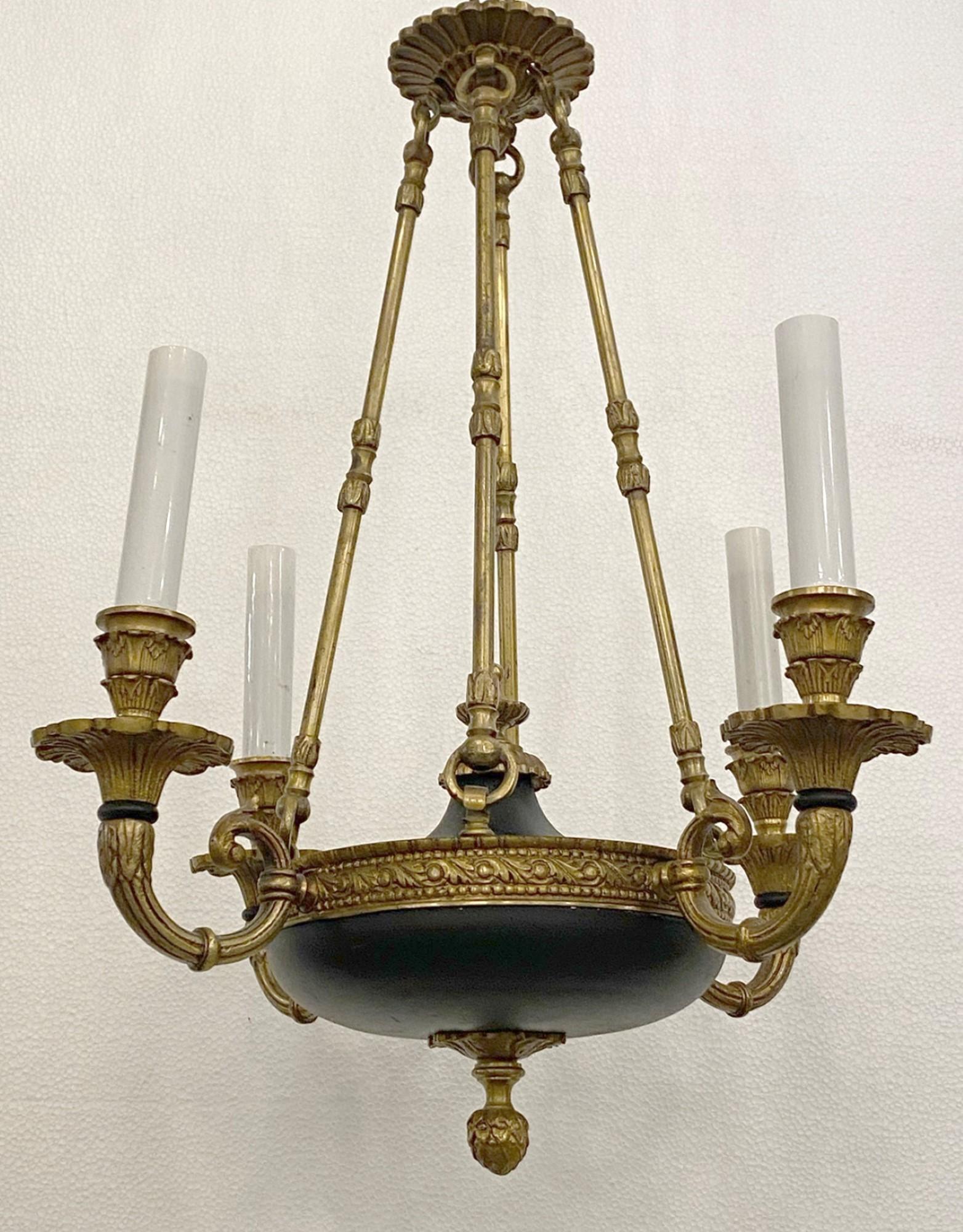 From the NYC Waldorf Astoria Hotel Towers on Park Ave in NYC, this 1940s cast brass Empire chandelier features 4 candelabra lights. Retrieved from the 37th floor of the Waldorf Towers. A Waldorf Astoria authenticity card included with your purchase.