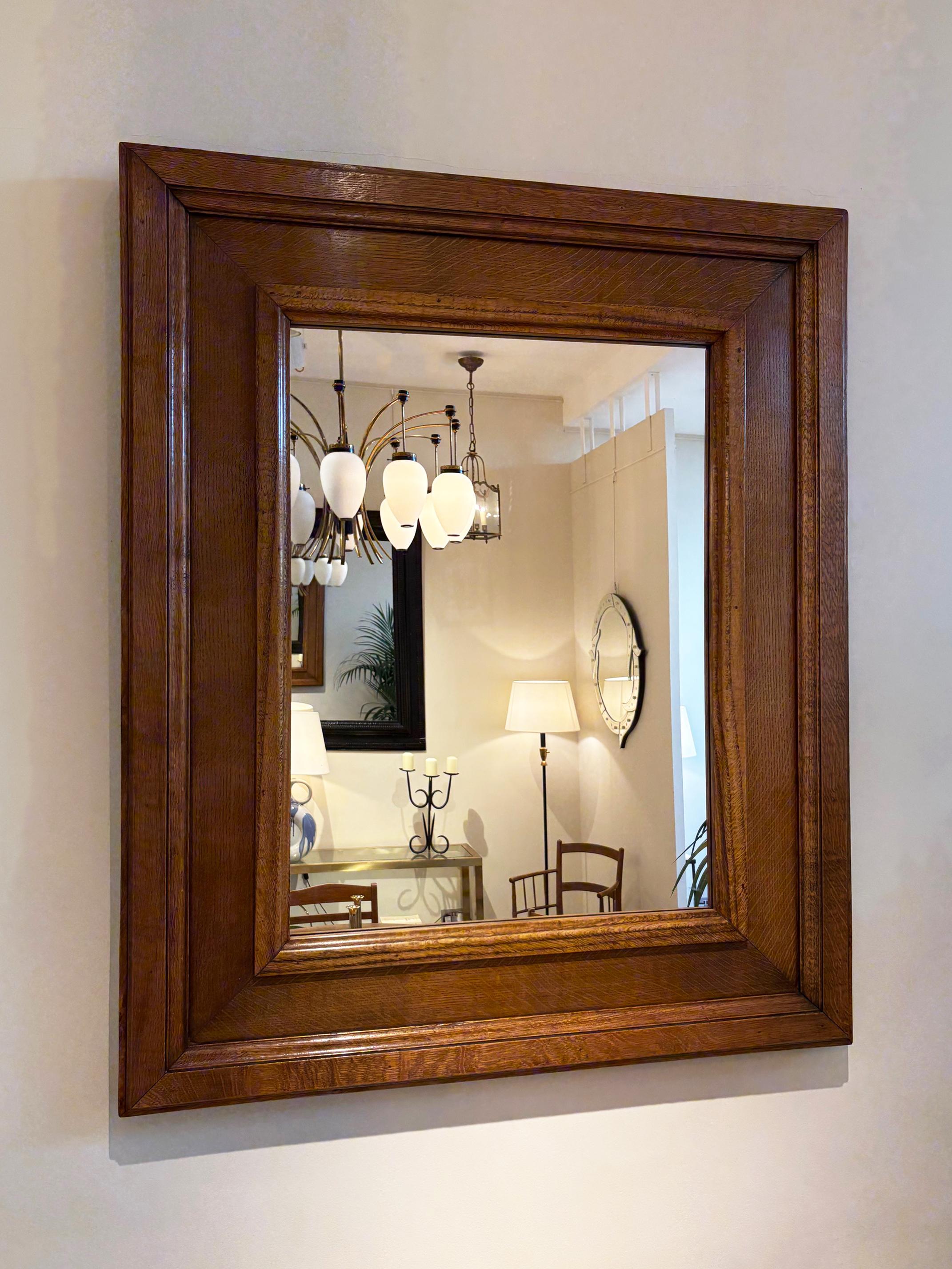 A moulded oak mirror
France, Circa 1940
