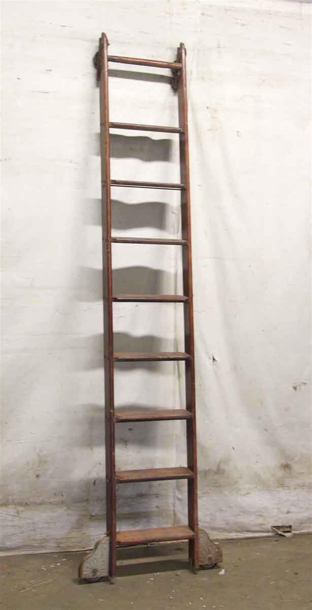 Original oak rolling library ladder with great patina. Made by Putnam, circa 1940. This can be seen at our 2420 Broadway location on the upper west side in Manhattan.