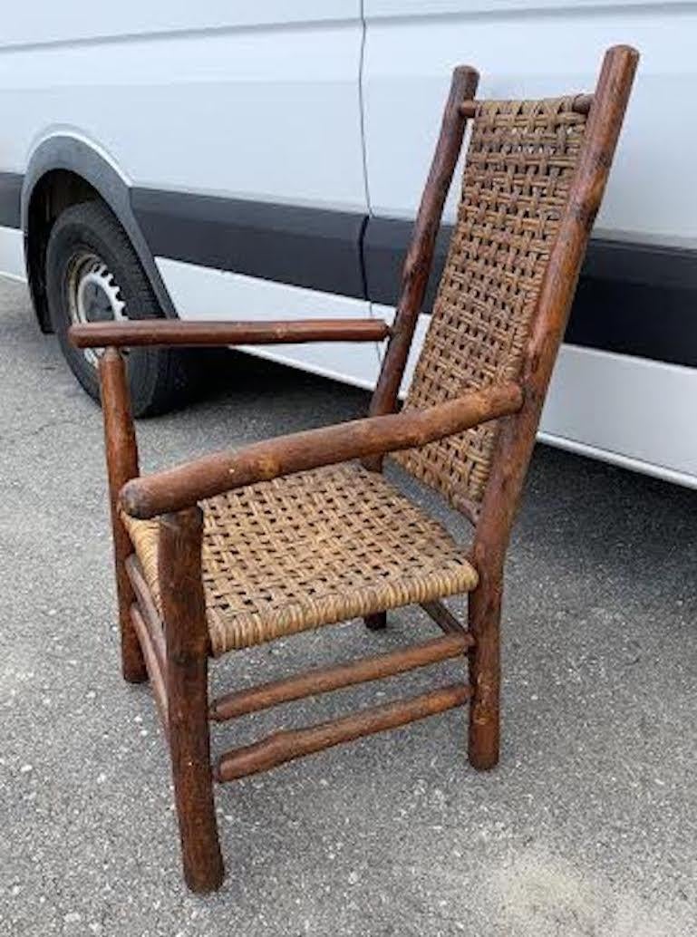 1940's Old Hickory High Back chair has original open weave rattan cane seat and back. It is branded on a back leg Old Hickory Furniture Company Martinsville Indiana. It is one of the most comfortable Old Hickory woven chairs to sit in due to its