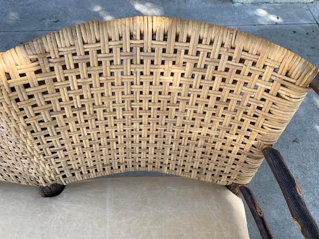 This amazing double barrel back Old Hickory settee is in fine condition. The seat is done in buckskin leather and backing is in original hand woven rattan. This settee / bench is so comfortable and very sturdy & heavy.
