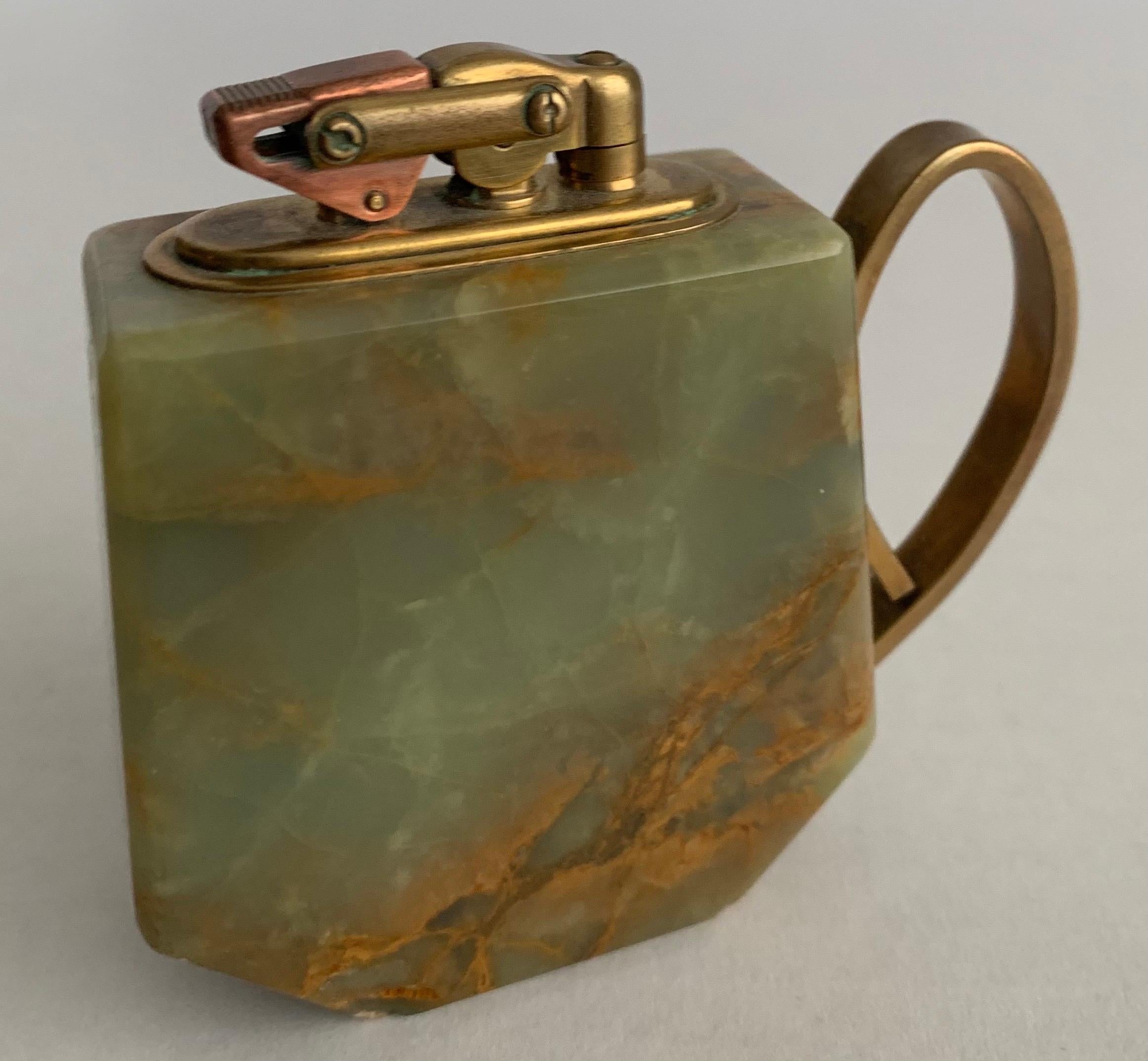 1940s green onyx and brass tabletop lighter. Heavy, well made lighter. 
No makers mark or signature. Not tested for working condition.