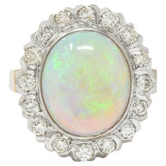 1940's Opal Diamond 14 Karat Two-Tone Gold Vintage Halo Ring