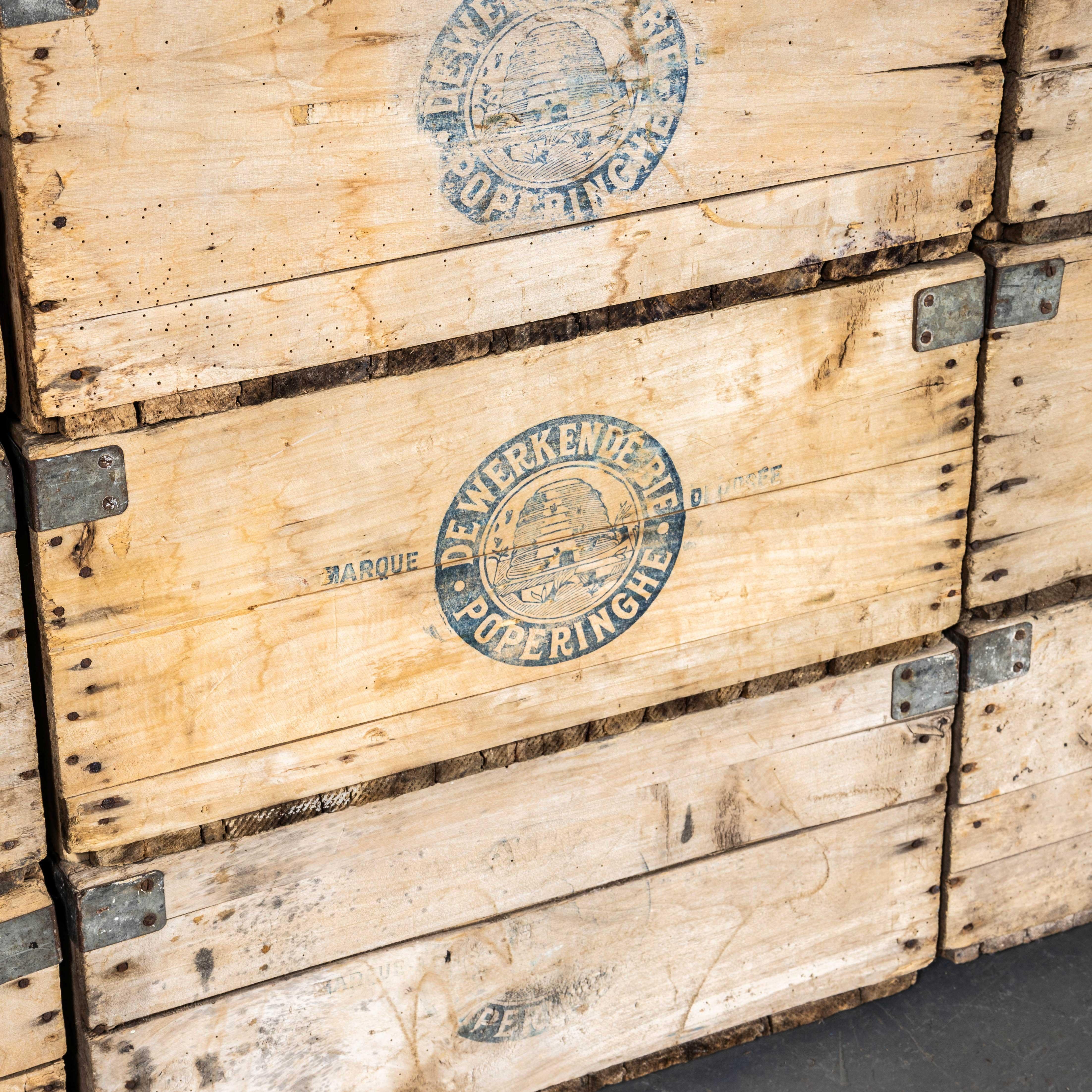 1940's Original Storage Crates By De Werkeende Bie - Poperinghe. 

Very rare original Belgian crates from 'De Werkeende'. Founded by Henri Maes in 1930 a humble bakers to start, they developed a famous spiced cake typically given at Christmas but