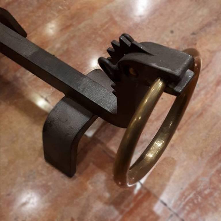 A pair of firedogs manufactured by Atelier di Varedo, 1940s. Wrought iron and brass. 7.7 (H) x 15.3 x 4.7 inches. Publicated: Giuliana Gramigna, Fulvio Irace, Osvaldo Borsani, Leonardo-De Luca Editori, Roma, 1992, p. 185.