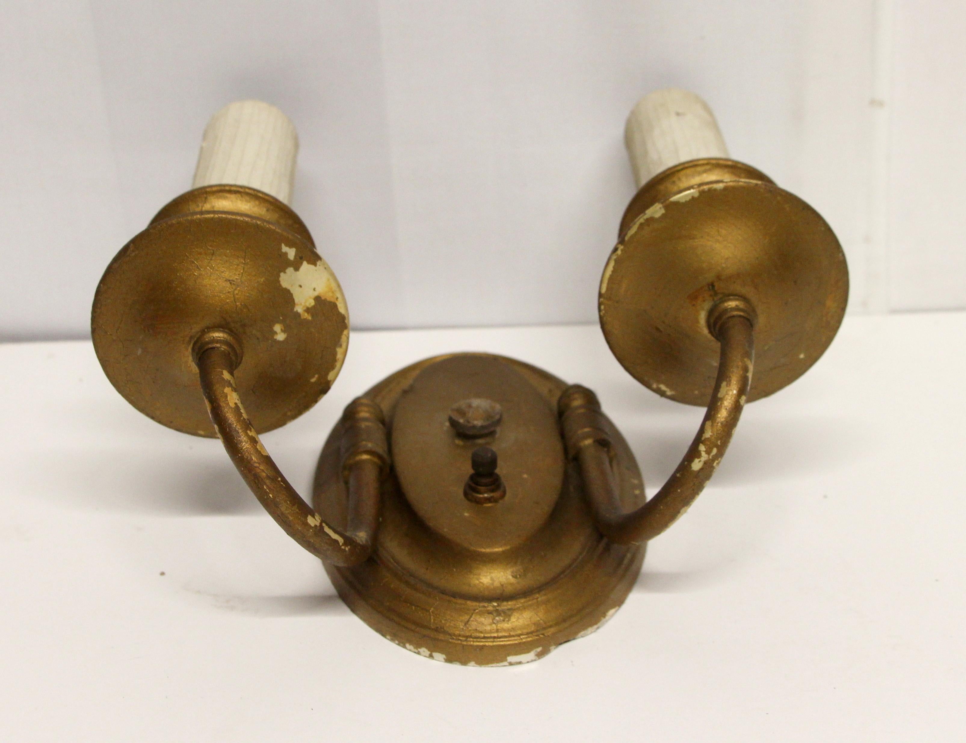 Double arm traditional style brass candlestick sconce with a painted gold finish from the 1940s. Small quantity available at time of posting. Priced each. Please inquire. Please note, this item is located in our Scranton, PA location.