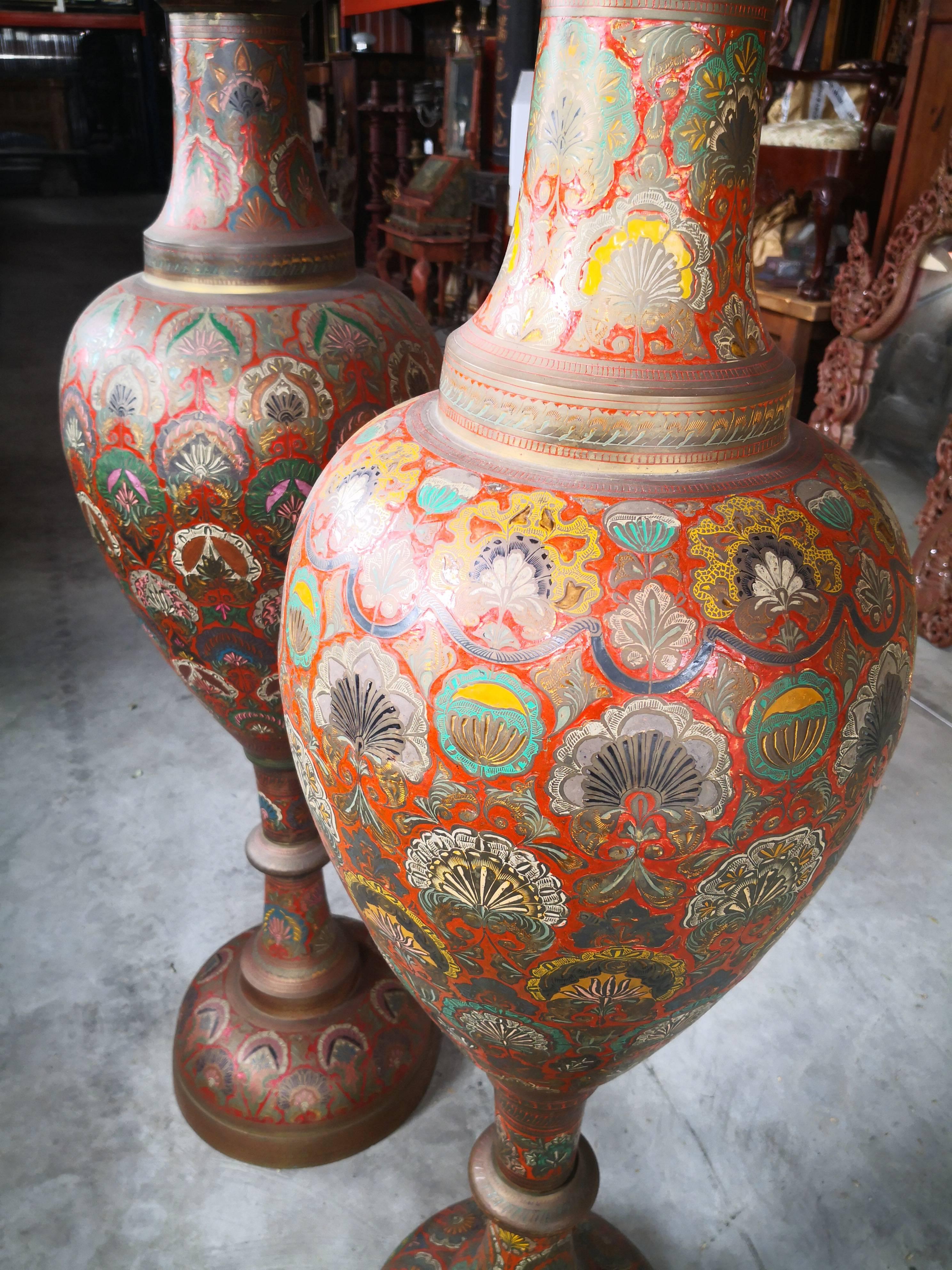 1940s pair of bronze polychrome enameled vases in Arabic style, using ornamental geometric and floral patterns.