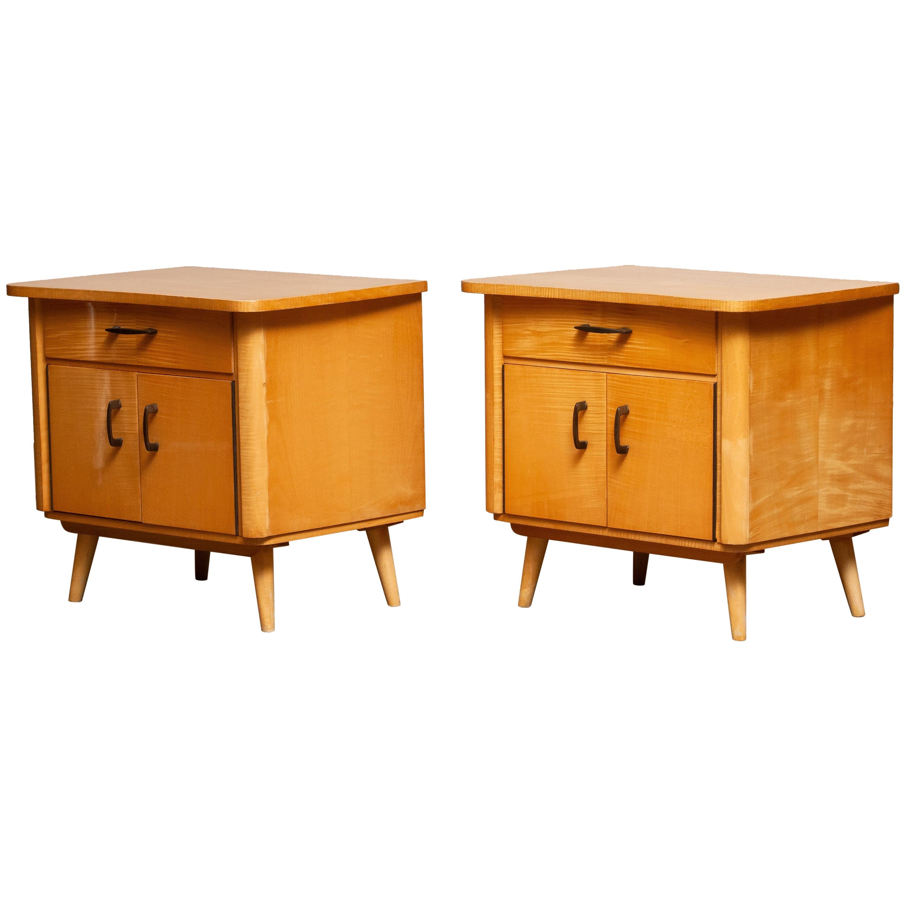 Beautiful set of two elm nightstands or bedside tables with drawers and doors made in Sweden. Both in good condition.