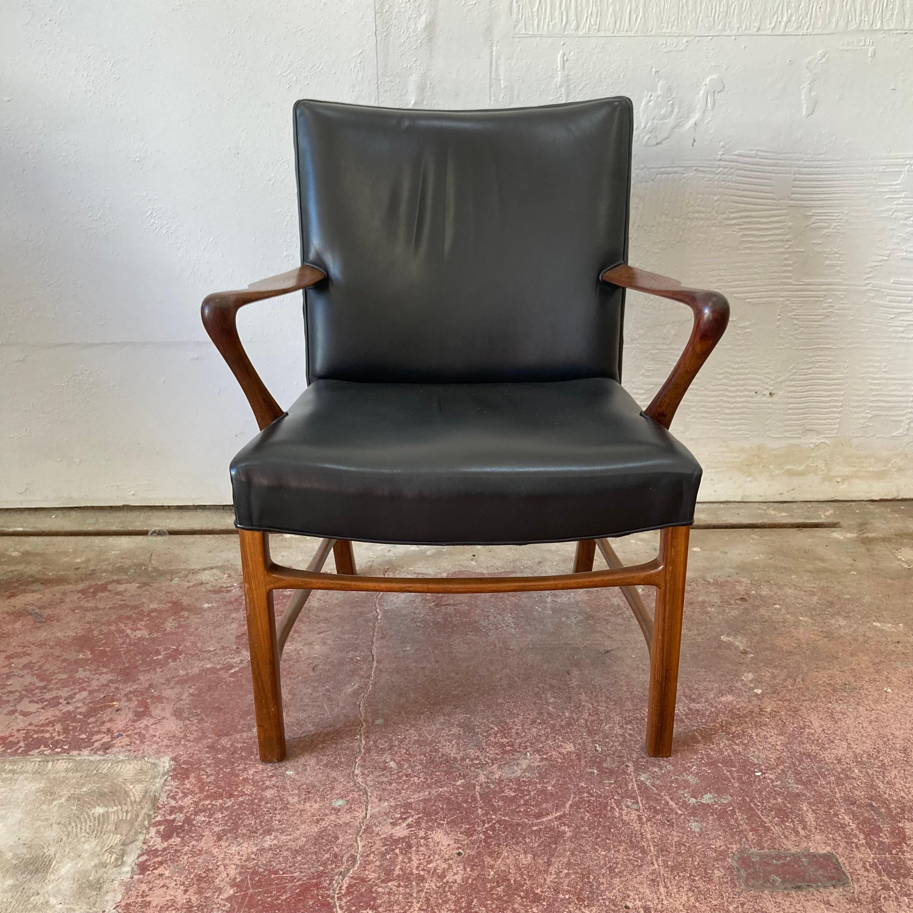 This is an exquisite sculpted armchair in rosewood, designed by Danish modernist architect Palle Suenson for Jacob Kjaer, it dates from 1948. It was made in Denmark. 

The chair really showcases the elevated concept. It has elegantly curved arms and