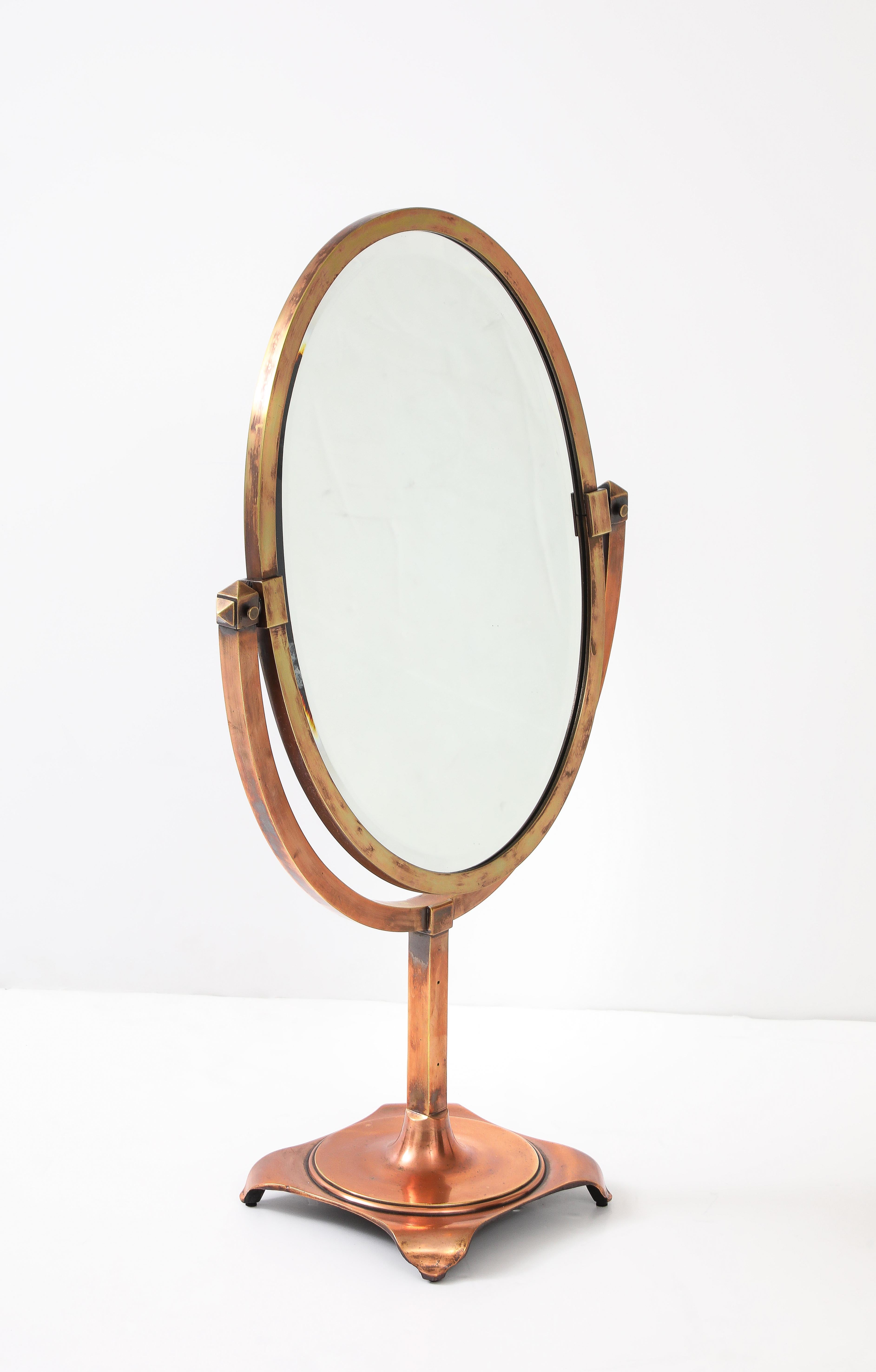 Amazing 1940's art-deco style large copper double sided beveled vanity mirror by JR Palmenberg's & Sons, lightly hand-polished with some wear and patina due to age and use, made of copper and brass with solid iron base. 