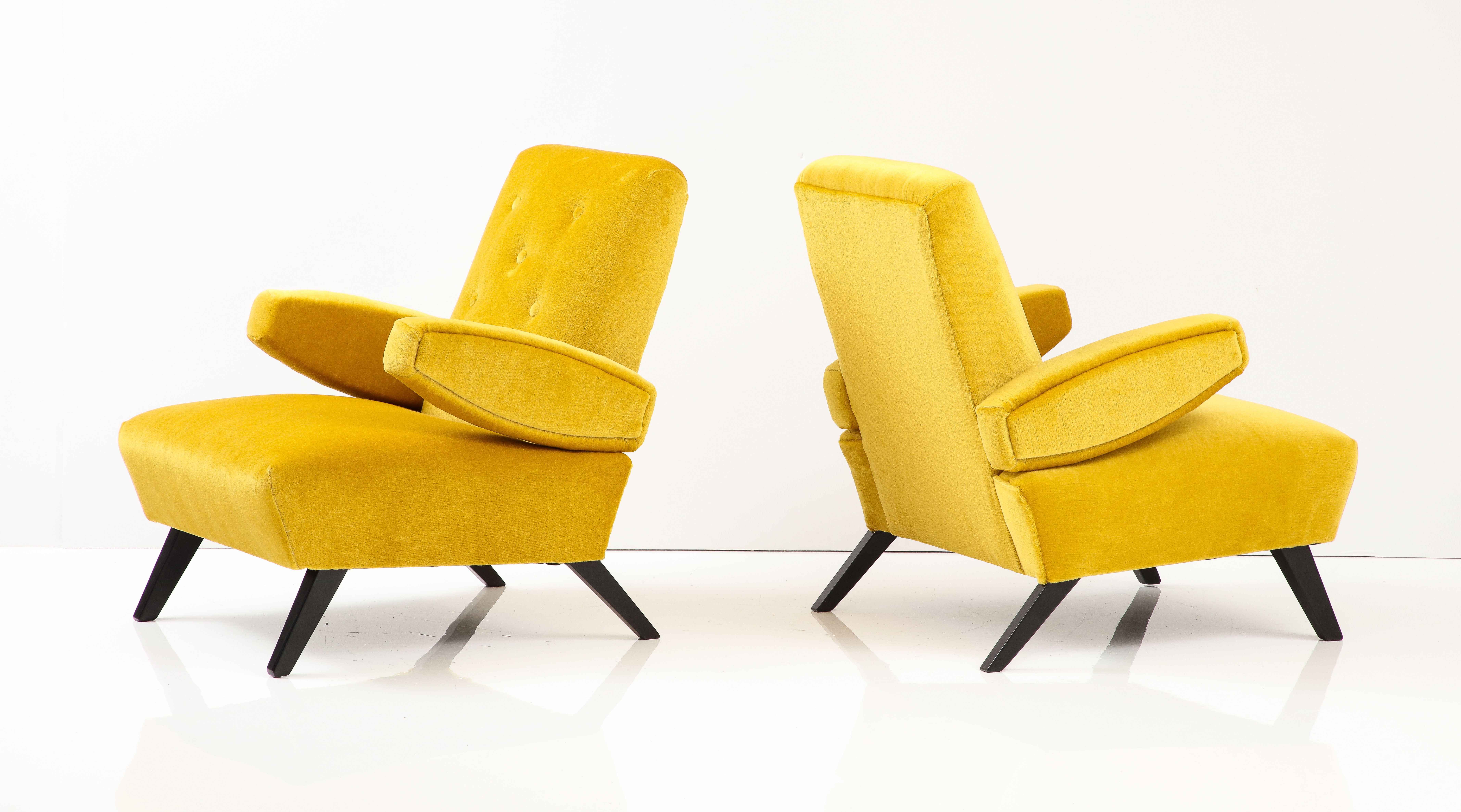 Amazing pair of floating arms 1940's lounge chairs attributed to Paul Laszlo, fully restored and newly re-upholstered in Donghia mohair, with minor wear and patina due to age and use, the chairs are well made and very heavy.