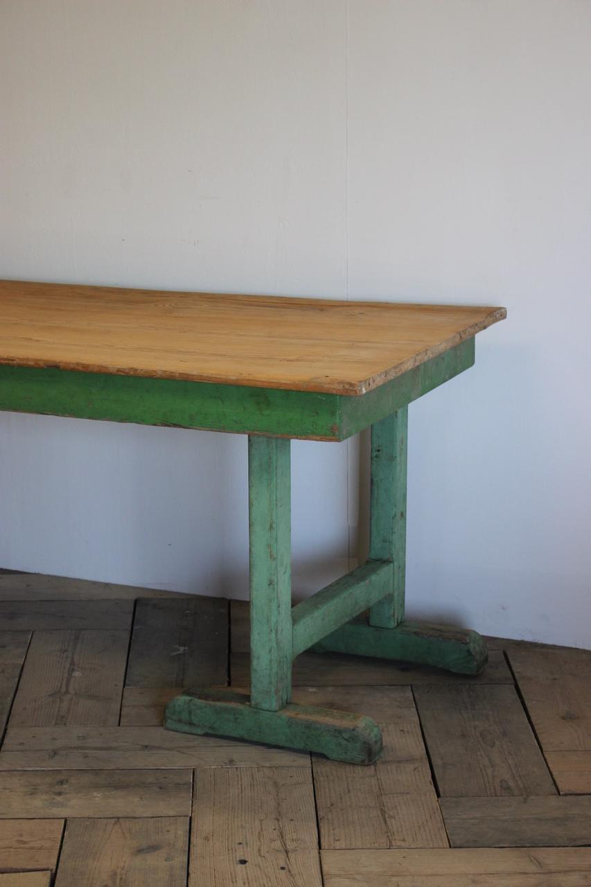 A very rusting and with a lovely color, circa 1940s painted dining table, retaining the original painted base, that will seat eight people comfortably. The pine top of an earlier date. Originally from a Florist shop.
Measures: Leg high 66 cm.
