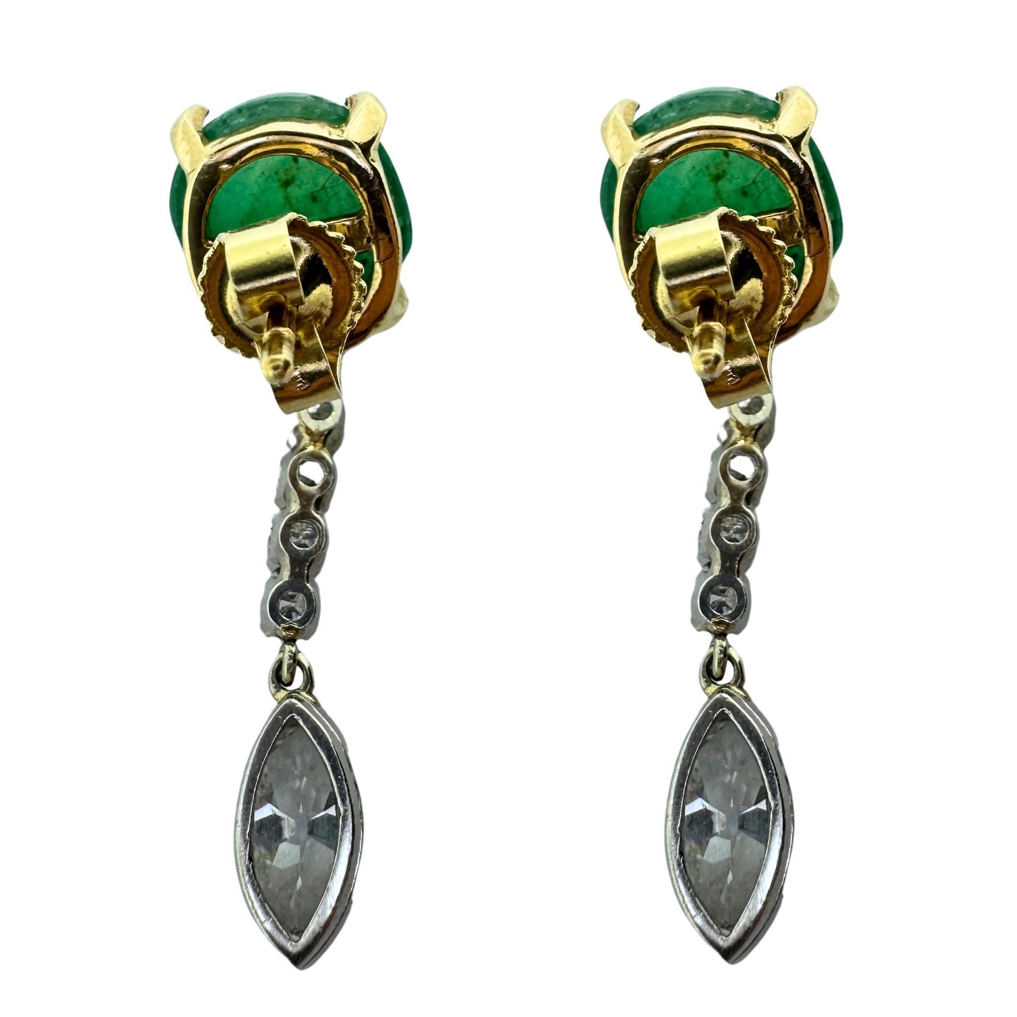 These vintage earrings feature a stunning combination of platinum, 18k yellow gold, diamonds, and cabochon emeralds. In excellent condition with minimal wear, these 1940's earrings measure 1.25 inches in length and weigh 6.6 grams. With a total