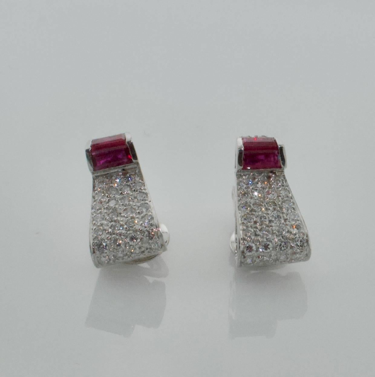 1940's Platinum and Gold Ruby and Diamond Earrings
Four baguette Cut Rubies weighing .60 carats approximately
Fifty Eight Round Brilliant Cut Diamonds weighing 1.70 carats approximately GH VVS-VS
Clip Backs are 18k White Gold with France Eagle