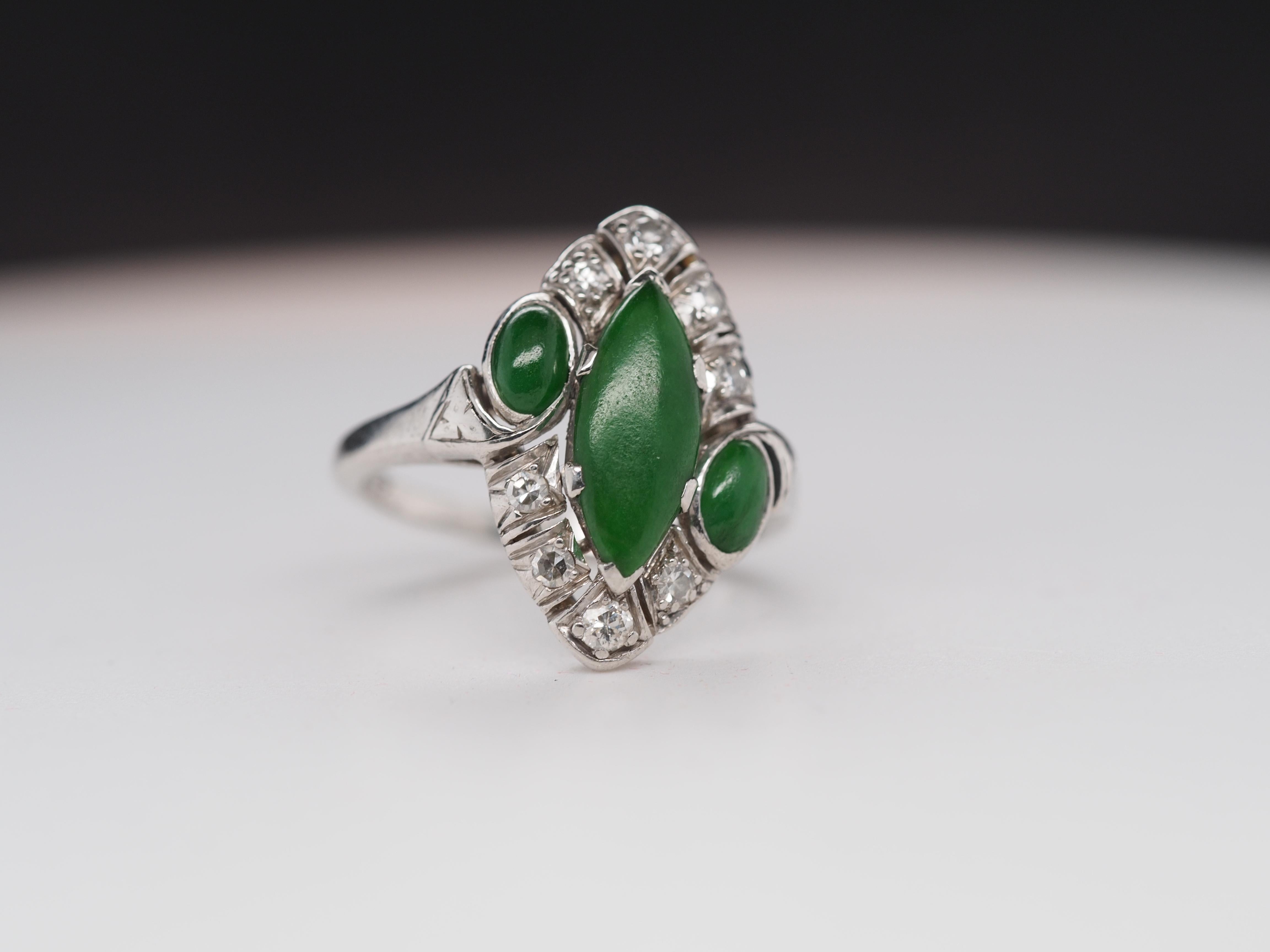 Item Details:
Ring Size: 5.5
Metal Type: Platinum [Hallmarked, and Tested]
Weight: 5.3 grams
Center Stone:
Jade, Natural, Green, Opaque, Untreated.
Diamonds: Natural, Old European Cut, F-G Color, VS Clarity.
Band Width: 1.75mm
Condition: Excellent