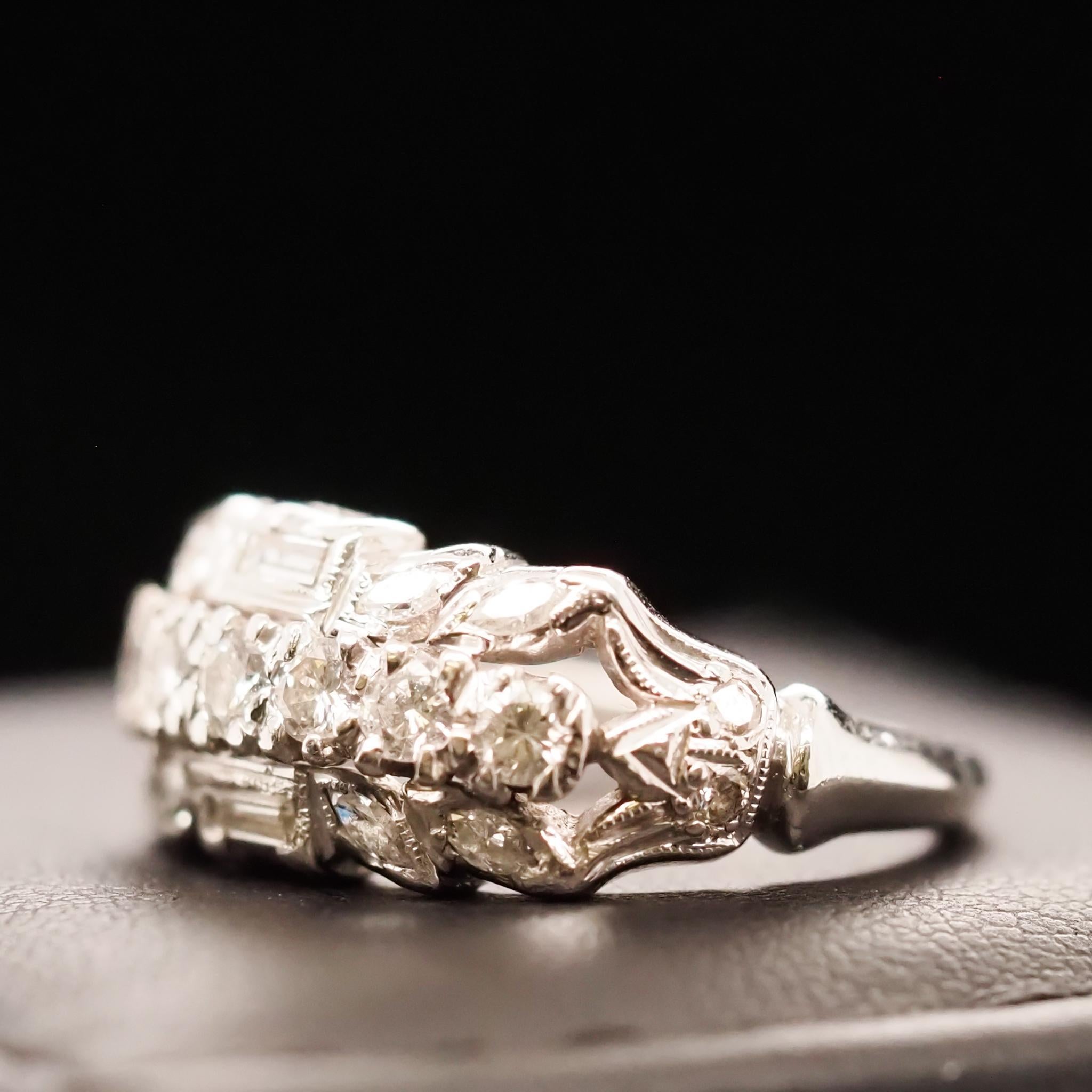 Year: 1940s
Item Details:
Ring Size: 5.5
Metal Type: Platinum [Hallmarked, and Tested]
Weight: 7.5 grams
Diamond Details: .75ct, Old European and Baguette Cut, F-G Color, VS Clarity
Band Width: 1.8mm
Condition: Excellent
