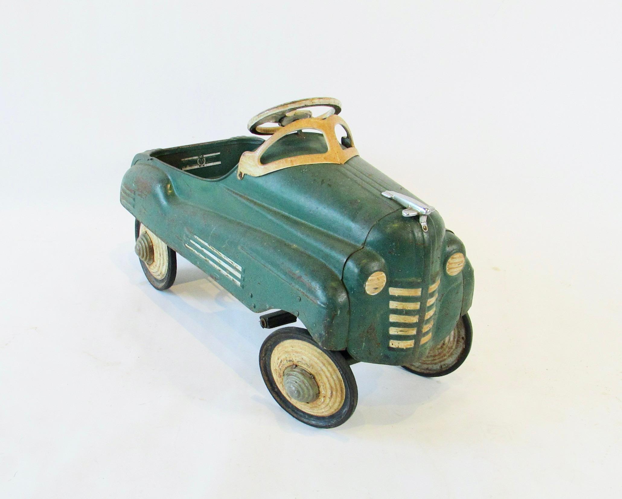 Pressed Steel Pedal Car by the Murray Co. Original paint vehicle showing patina .
