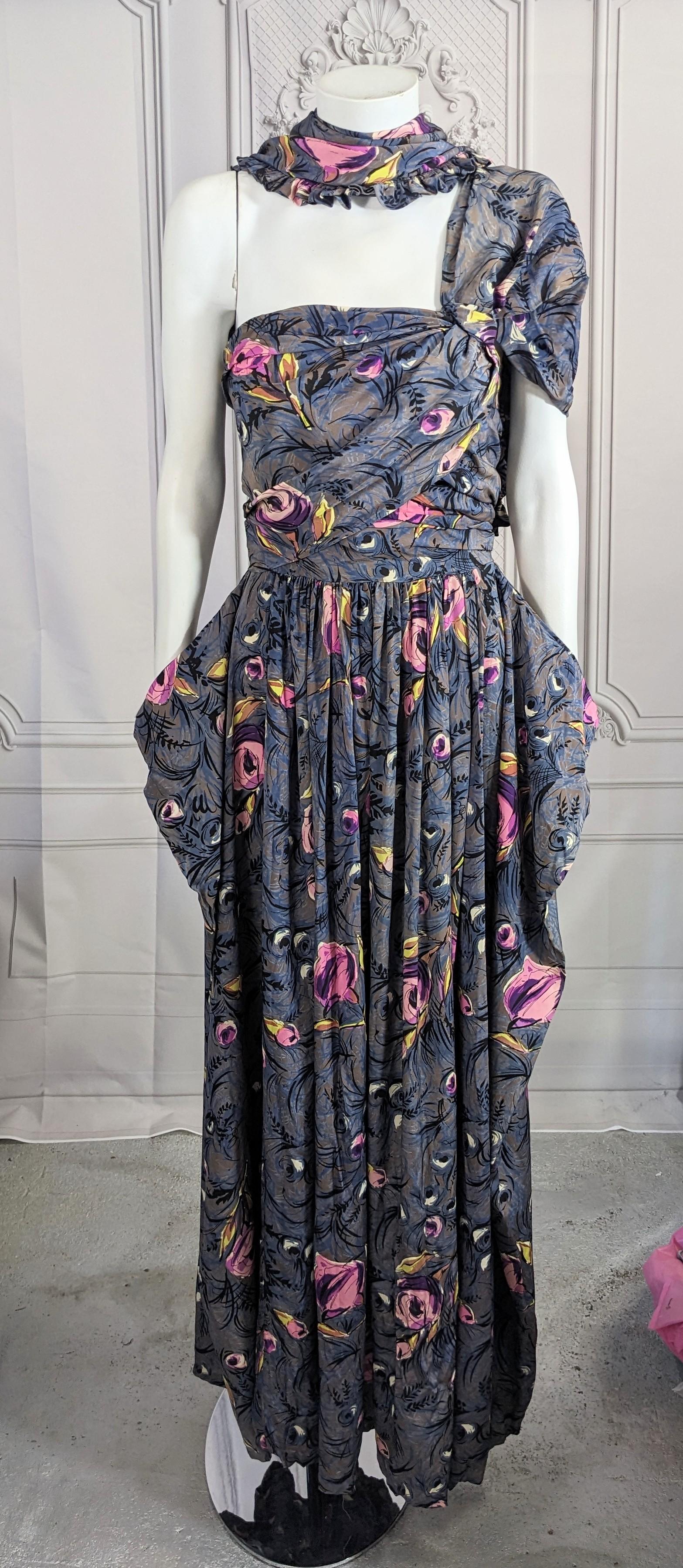 Elegant 1940's Draped Silk Crepe One Shoulder Gown with ruffled scarf. Draped bodice extends into shoulder with bralette stitched inside for support. Full skirt with panels at each side which drape. Silk crepe Retro floral print. Size 0-2. 1940's