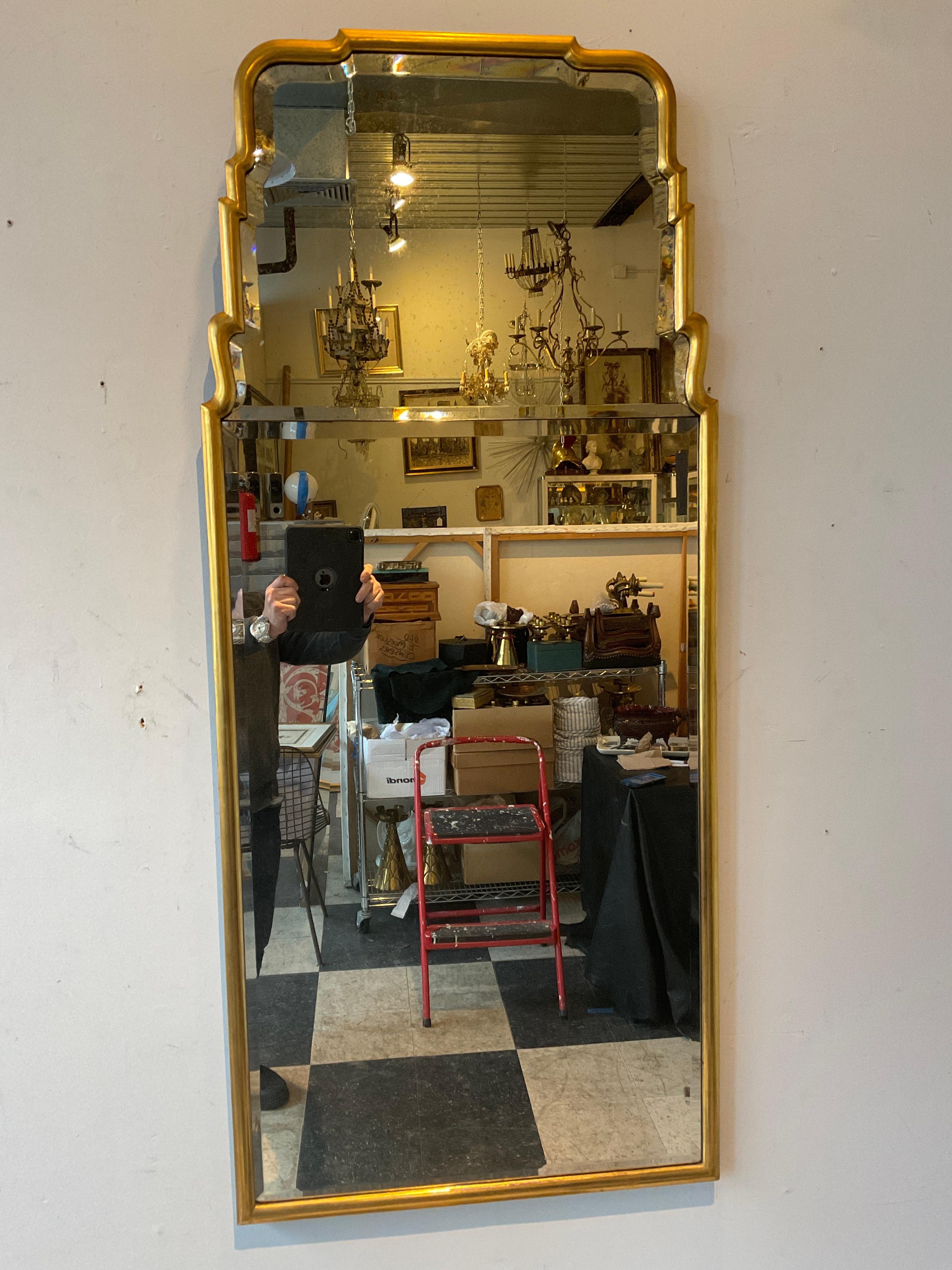 1940s Gilt wood Queen Anne beveled mirror. 2 pieces of beveled mirror form this very elegant piece.