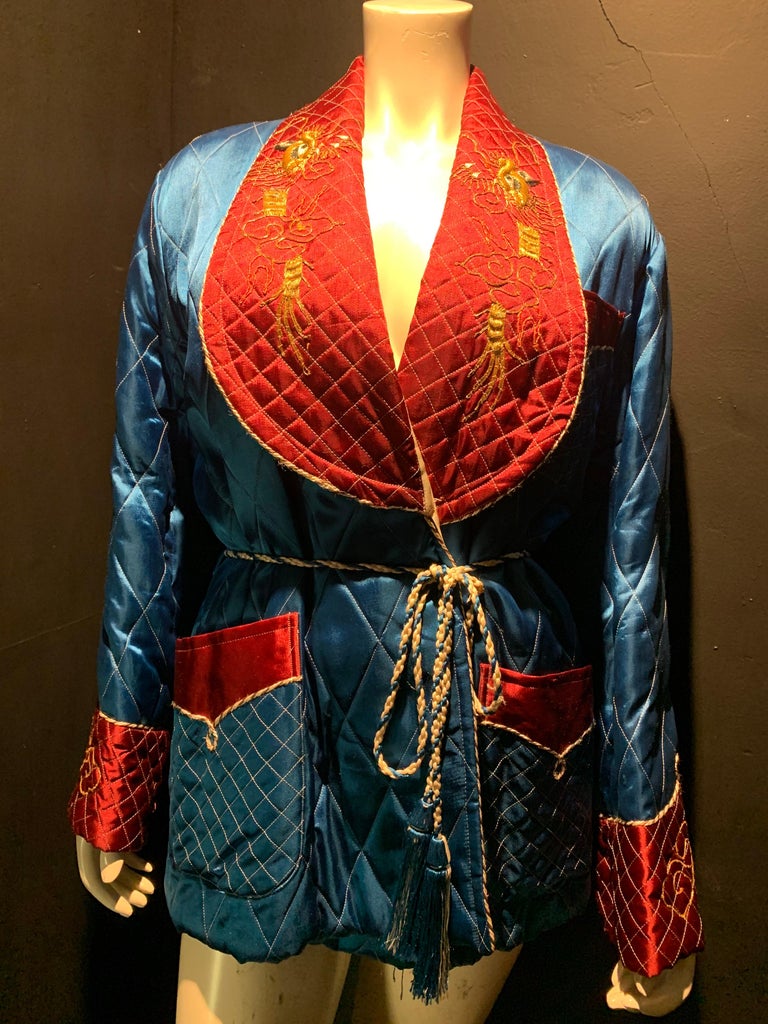 1940s Quilted maroon and royal blue Japanese men's satin smoking jacket with gold embroidered dragons. Original tassel belt included. Large bib-style lapels piped in braid. Size medium. 
