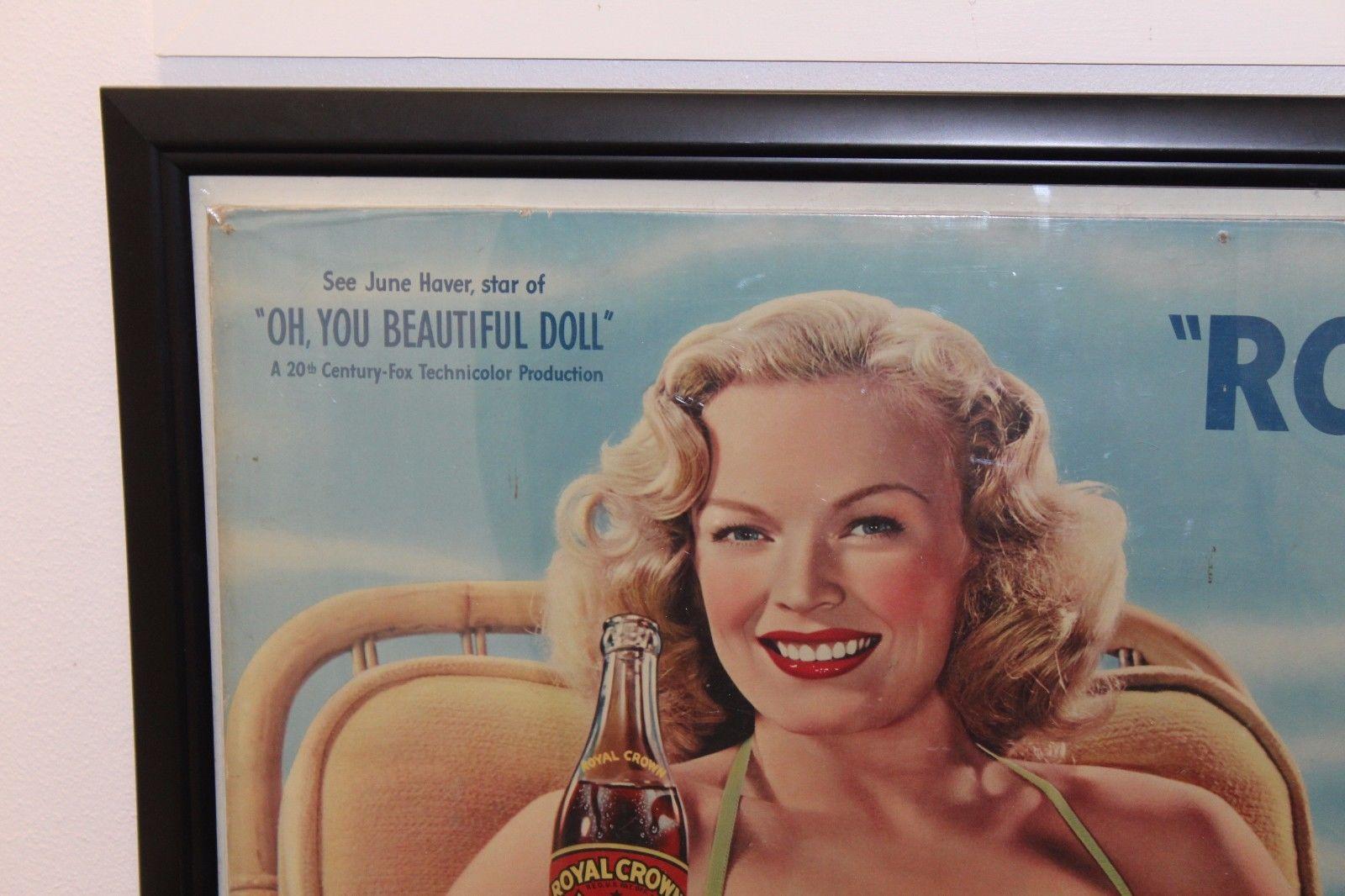 This piece is an Original RC Cola advertisement on a lithograph featuring June Havner, a noted American film actress in the 1940s. The slogan reads 