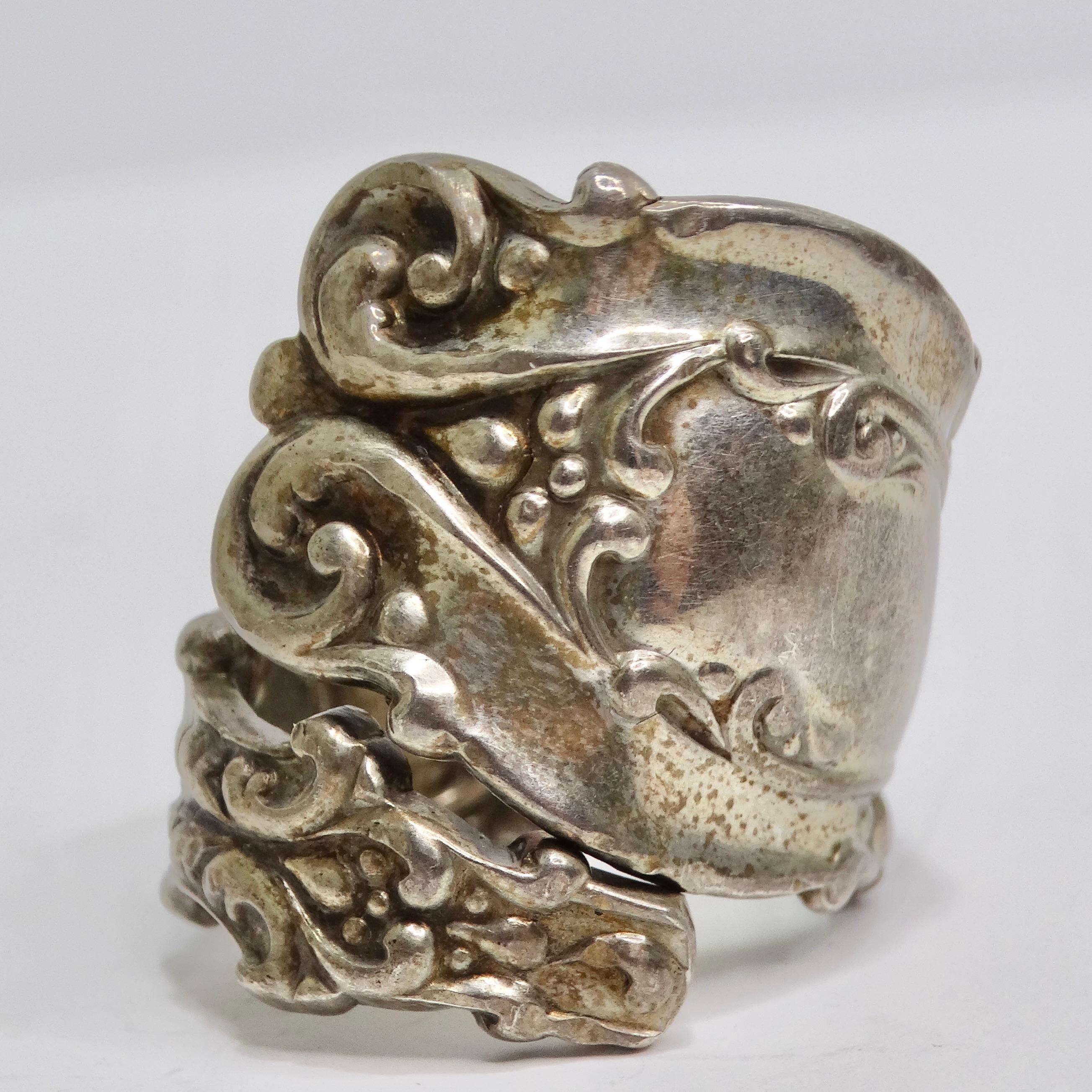 Elevate your style with our 1940s Reconstructed Silver Spoon Ring, a truly unique and one-of-a-kind piece of jewelry. Crafted from a reworked antique silver spoon, this ring is a special and exquisite accessory that pays homage to the past while