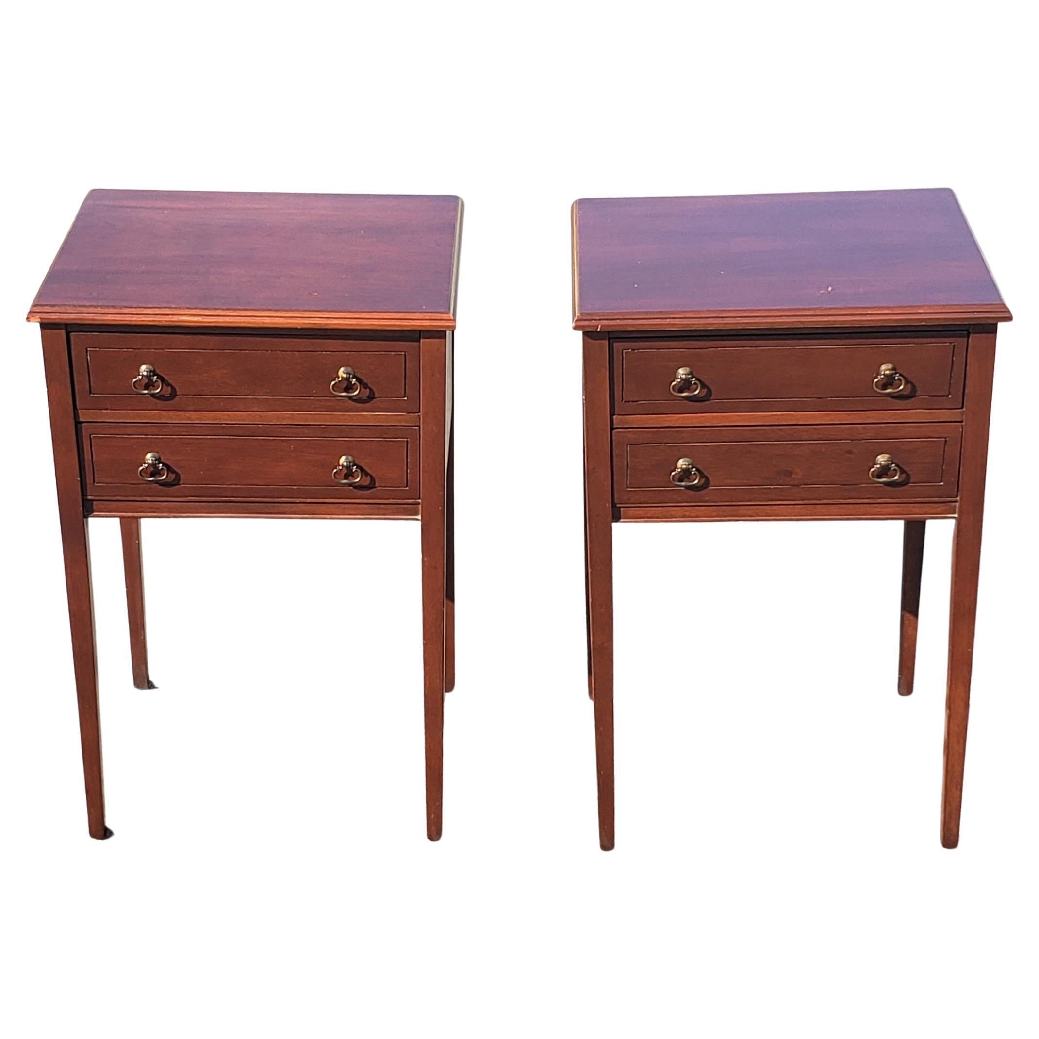 A pair of 1940s slender two-drawers Regency style mahogany side tables by Mersman Furniture.
Tables have been refinished recently and are in good vintage condition. Finished on all sides and measures 17