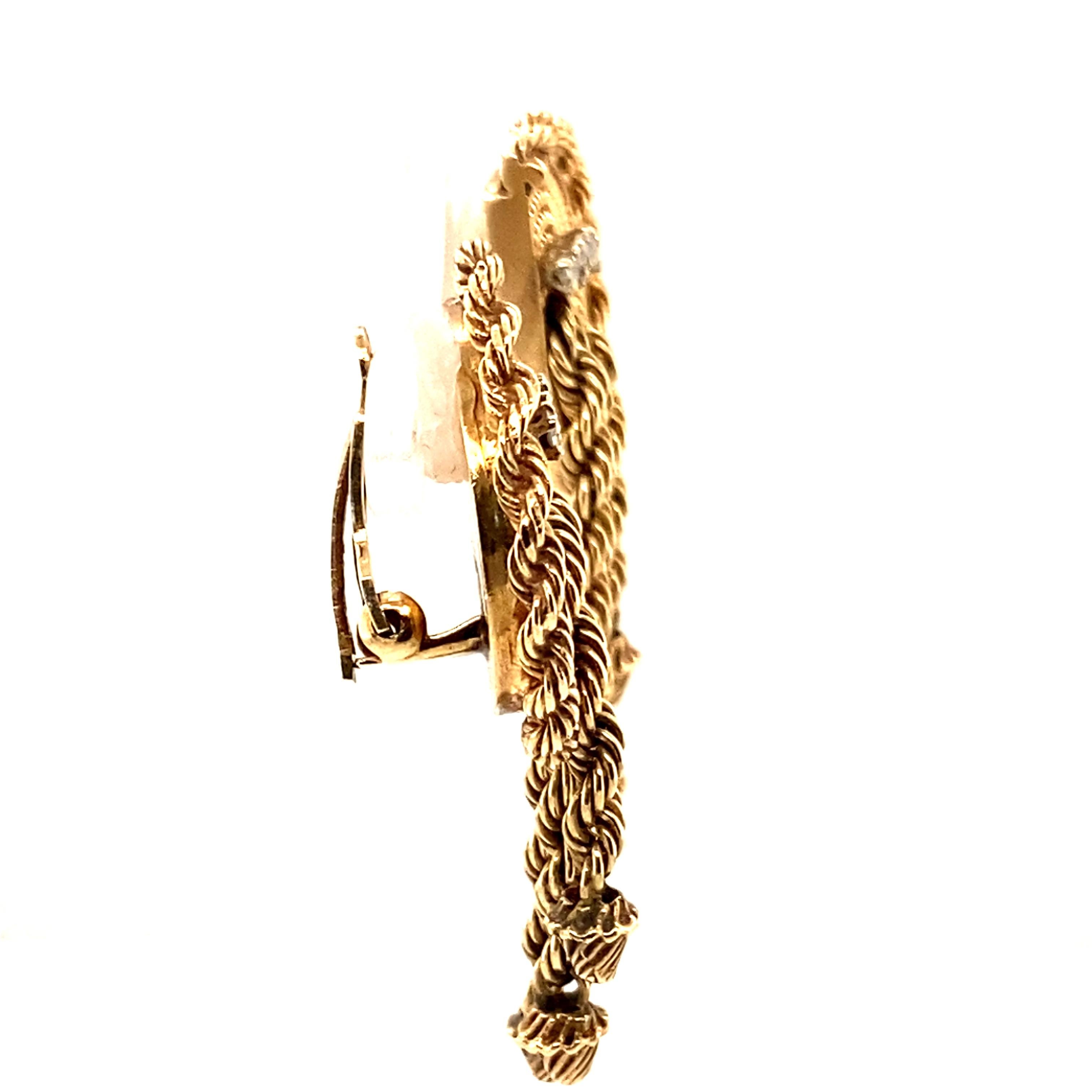 Item Details:
Type: 14 Karat Yellow Gold
Weight: 19.4 grams
Measurements: 2 inches length x 1 inch width 

Diamond Details: 
Cut: Round 
Carat: .24 Carat Total 
Cut: I-J
Clarity: SI

Item Features:
Circa 1940s featuring 3 tassels twisted rope