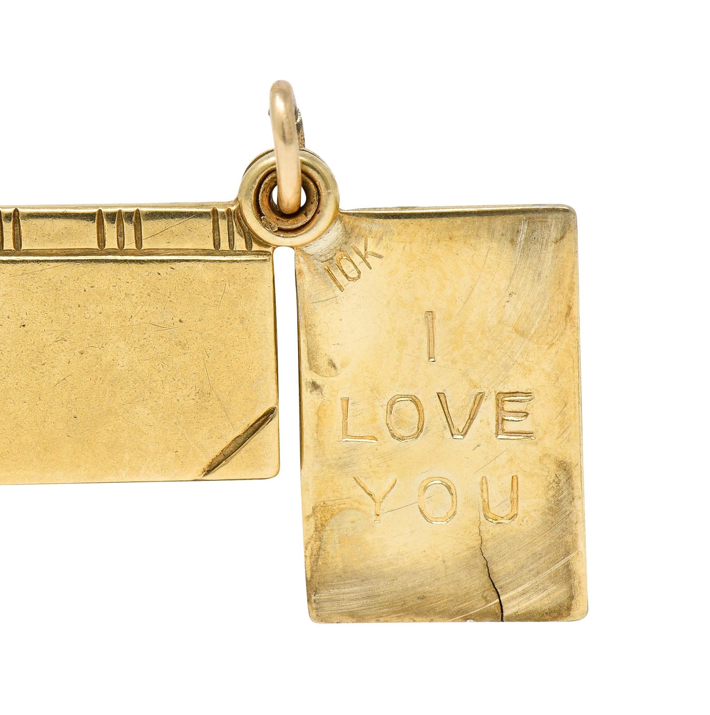 Charm is designed as a book with deeply engraved cover details

It swivels open to reveal the engraved words 'I Love You'

Completed by jump ring bale

Stamped 10K for 10 karat gold

Circa: 1940s

Measures: 3/8 x 5/8 inch

Total weight: 1.6