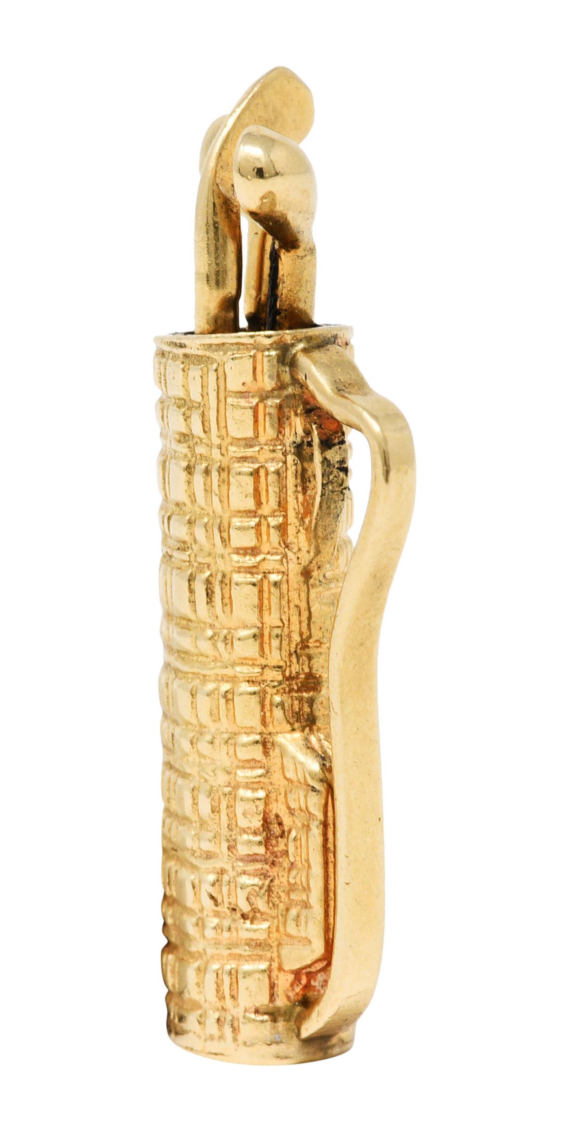 Charm is designed as a golf bag

With a highly texturous tweed patterning

And articulated clubs

Stamped 14K for 14 karat gold

Circa: 1940s

Measures: 1/2 x 1 inch

Total weight: 5.1 grams

Hitting. The. Green.
  

Stock Number: We-7651