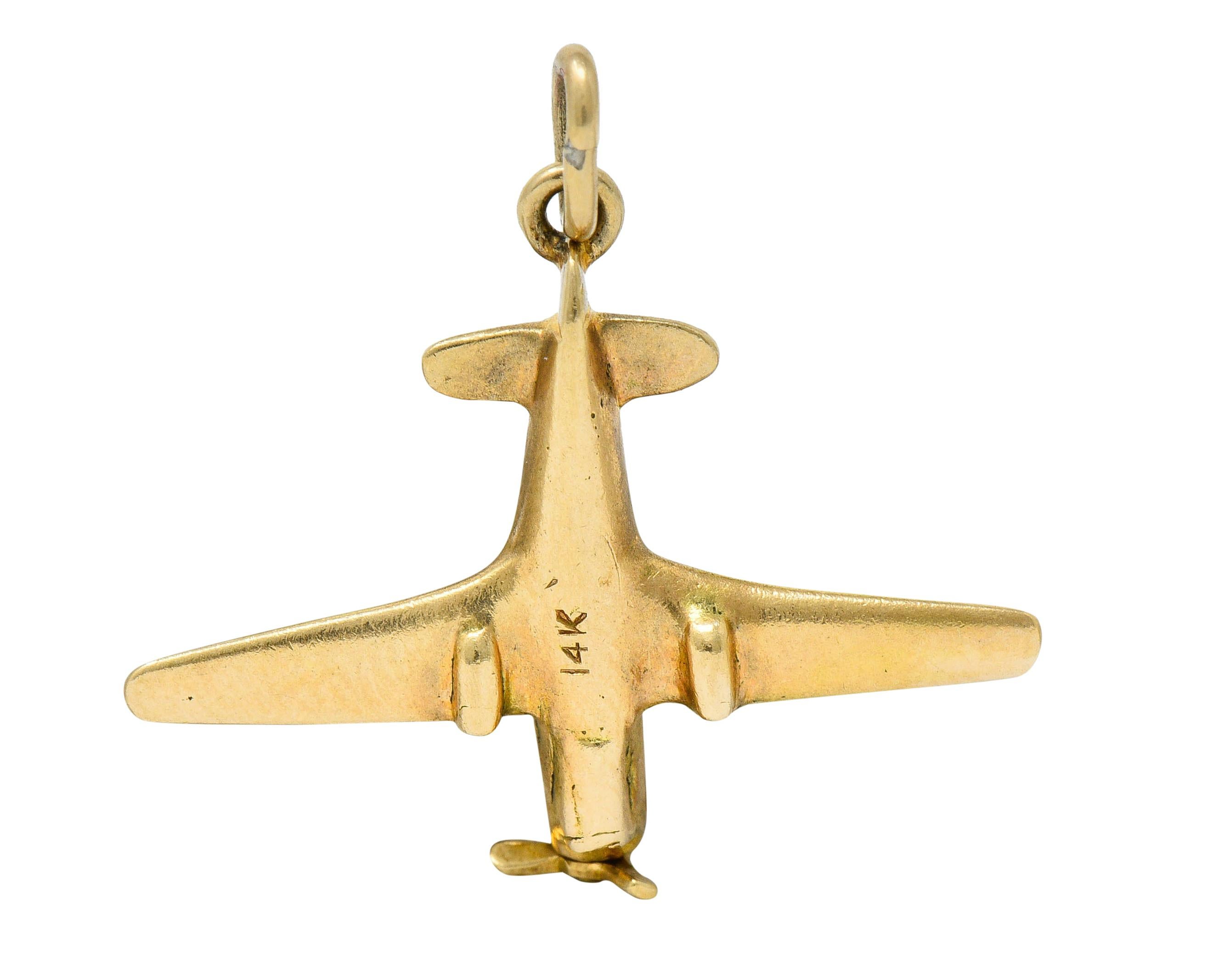 Designed as a stylized prop plane

With rotating propellers

Completed by a jump ring bale

Stamped 14K for 14 karat gold

Circa: 1940s

Measures: 1 x 7/8 inch (including bale)

Total weight: 2.9 grams

Bright. Aspiring. Aviation.
 

Stock Number: