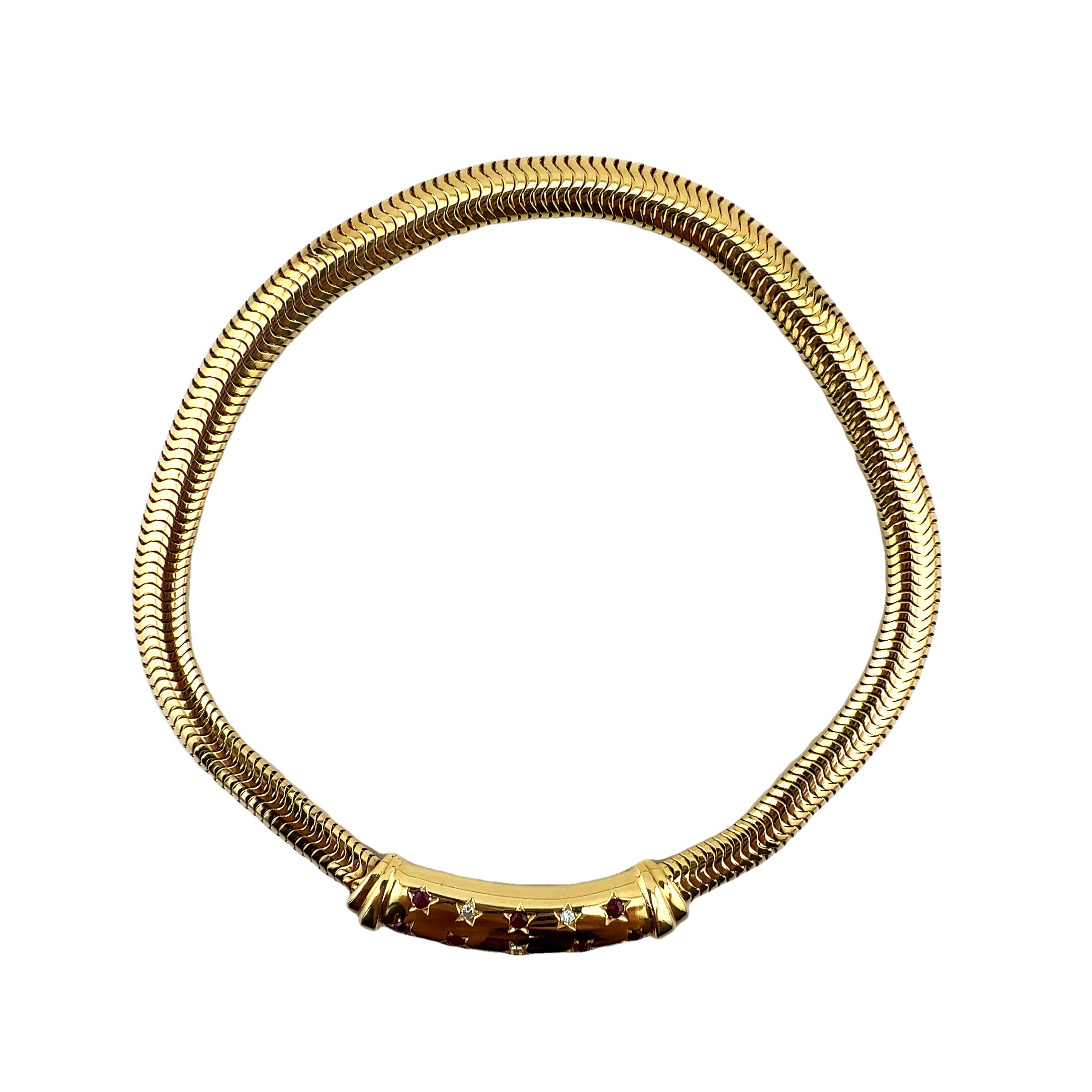 A striking example of 1940s retro glamour, this bold 14K yellow gold snake link necklace is a true collector’s piece. Weighing a substantial 109 grams, it features a sculptural slide centerpiece adorned with seven natural rubies (approx. 0.60