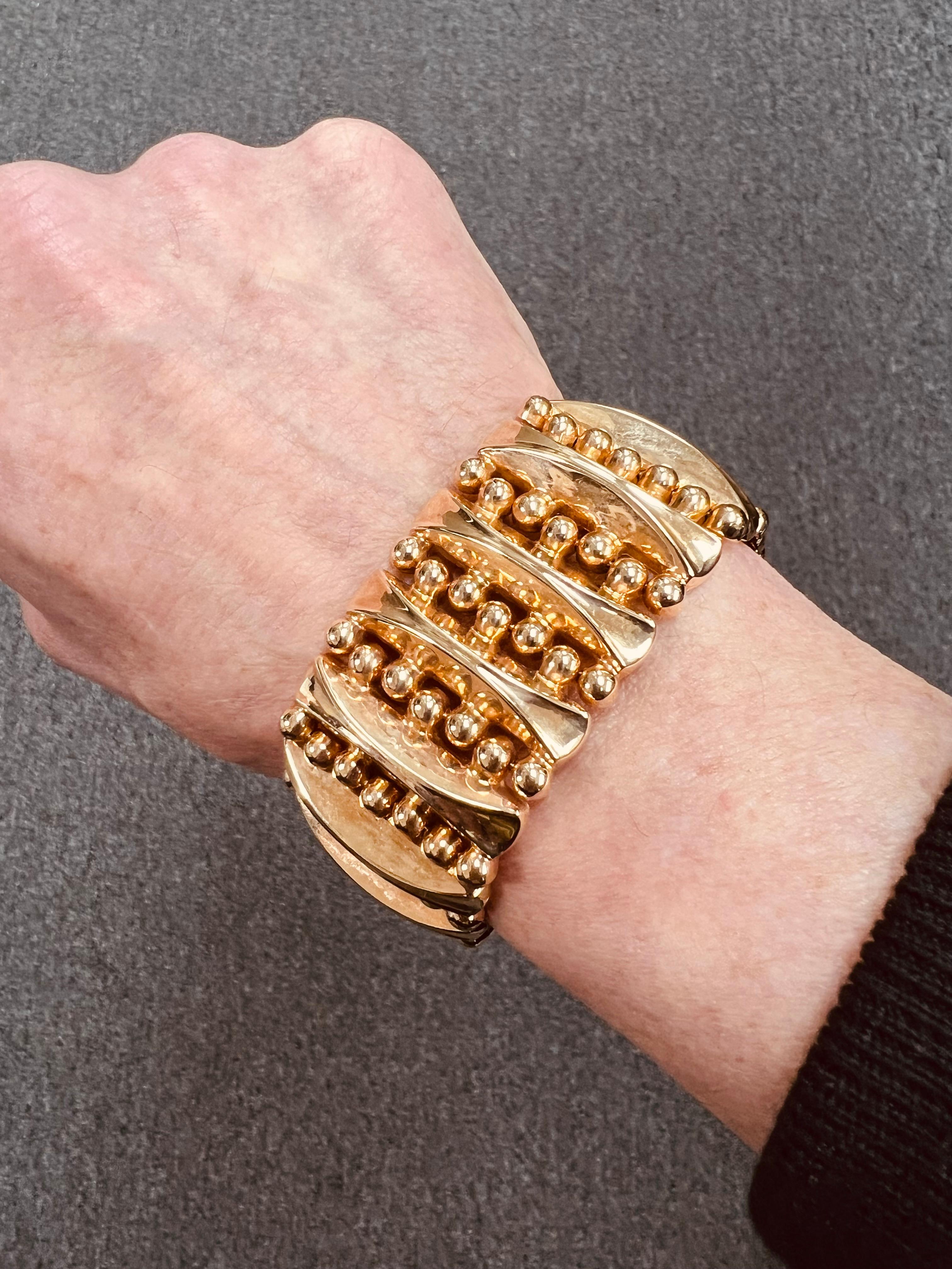 1940s Retro 18k pink gold wide tank bracelet.

The 1940s retro 18K pink gold wide tank bracelet represents a significant intersection of fashion and craftsmanship in vintage jewelry. Characterized by its distinctive 