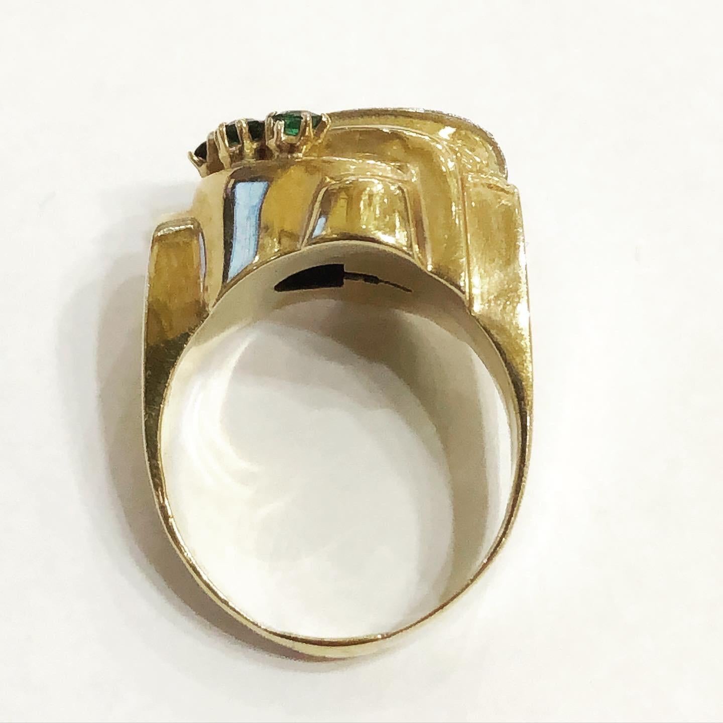 1940s Retro Diamond green Tourmaline Gold Tank Cocktail Ring.
Ring in 18 karat yellow gold. Superb tank ring, linear and geometrical design typical for this period.
Circa 1935-1940
Old European diamond cut.
Round tourmaline cut.
Total approximate