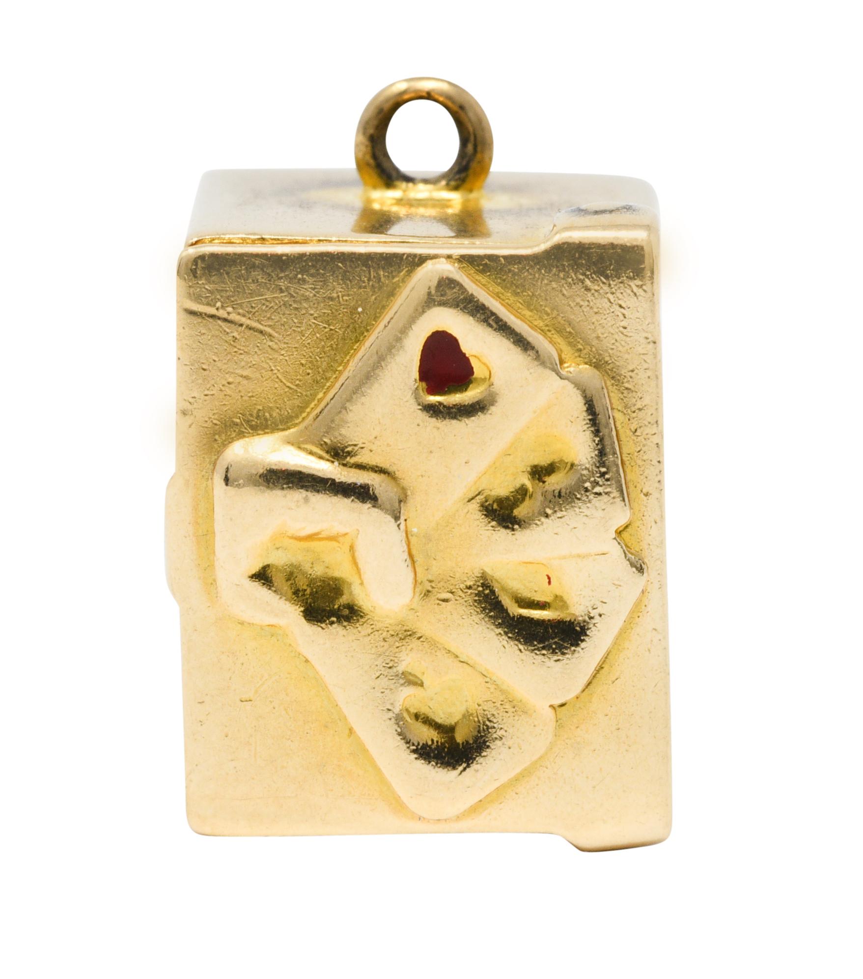 Charm is designed as a rectangular gold box

Lid features a repoussè card motif accented by remnants of red enamel

Opens on a hinge to reveal a stack of miniature cards

Box is pierced in front to show Queen of Hearts card

Back is pierced to show