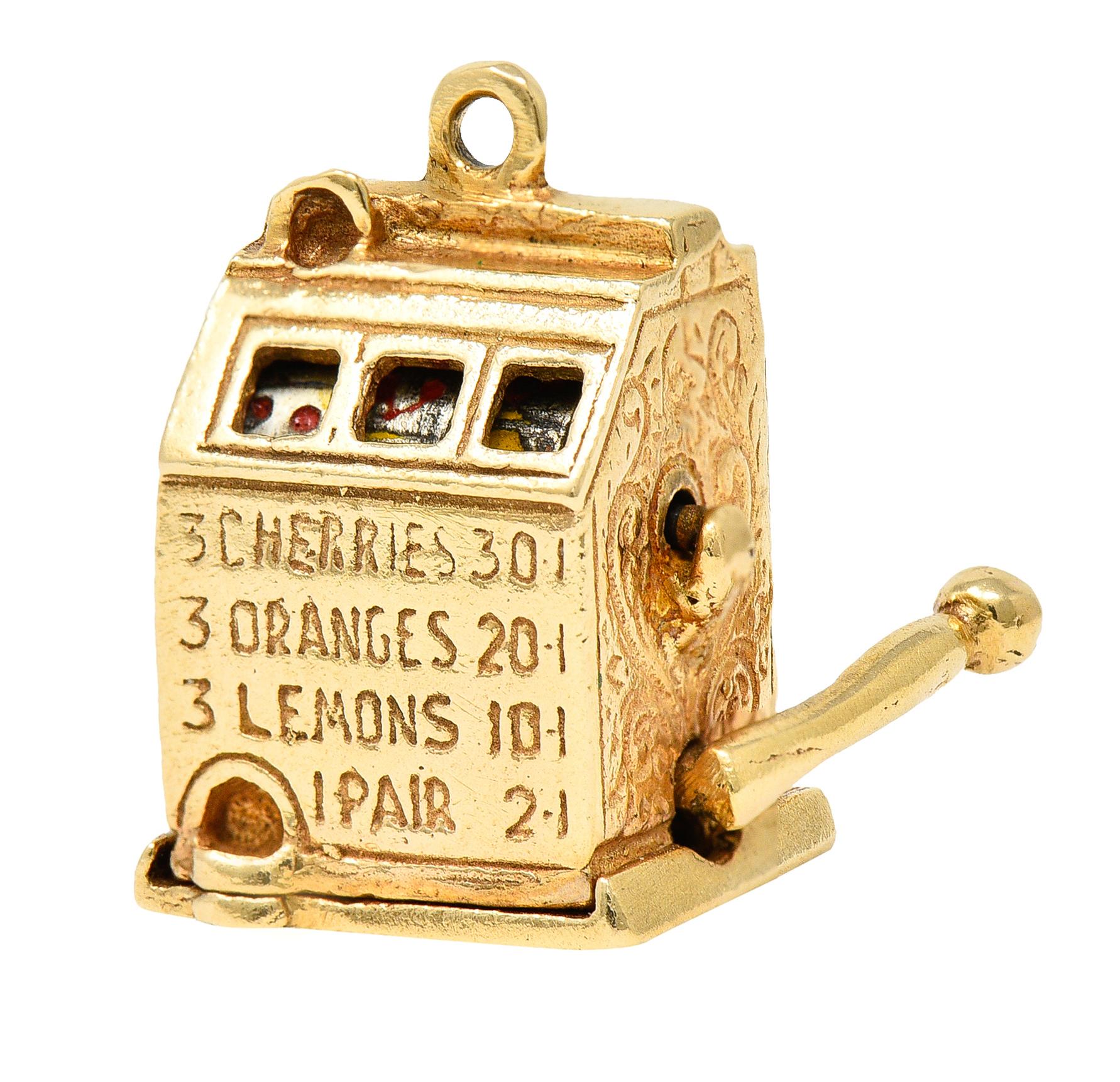 Charm is designed as a highly rendered vintage slot machine. With pierced viewing windows featuring enamel depictions of fruit - loss consistent with age and use. Functional lever to one side pivots North to South causing inner rotary to spin.