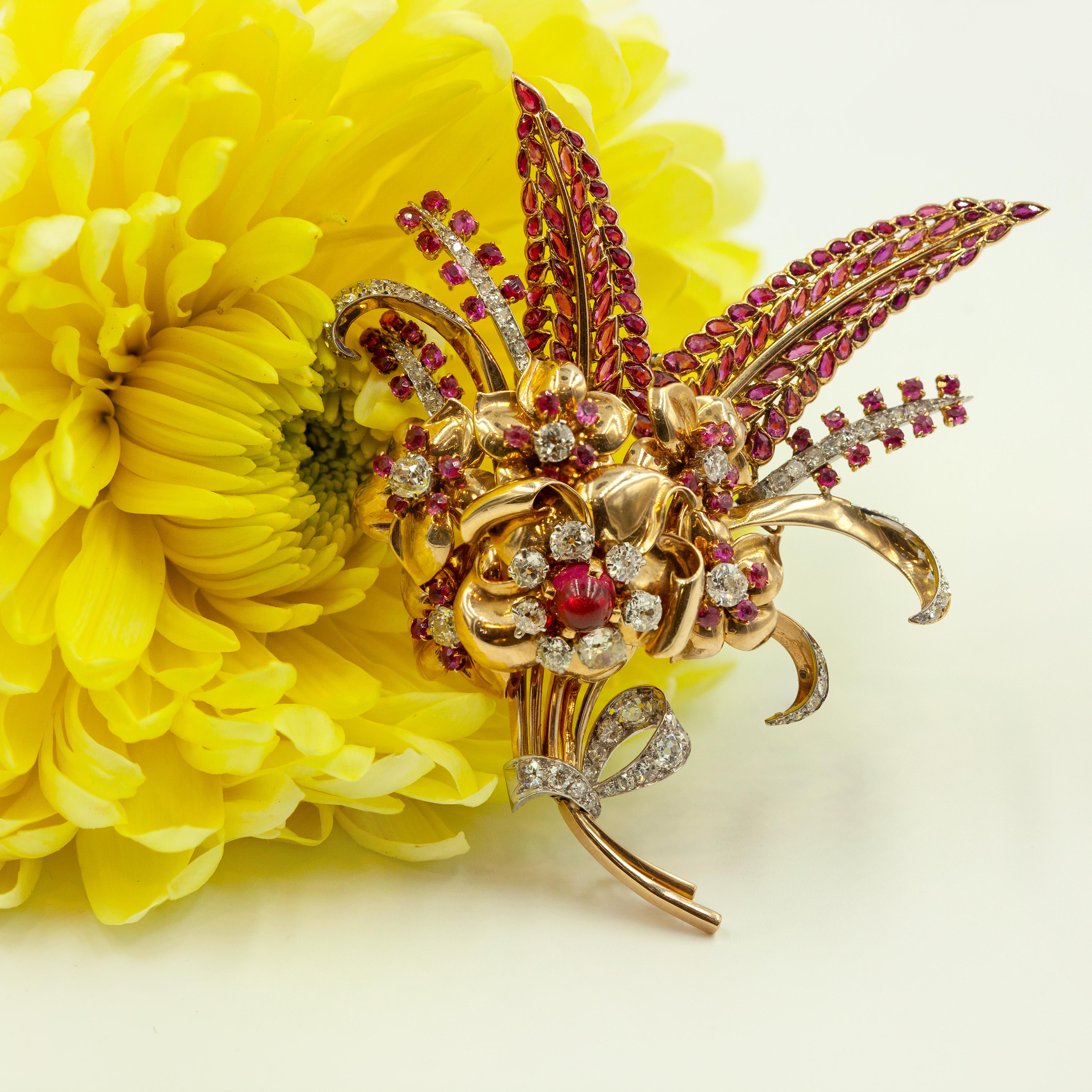 French Retro flower fur clip brooch from 1940s crafted in 18k yellow gold & platinum. The flower is in an organic form with old European cut and round cut diamonds (G-H color SI clarity) & natural rubies

Approximate Weight:
Gross ~ 44.20