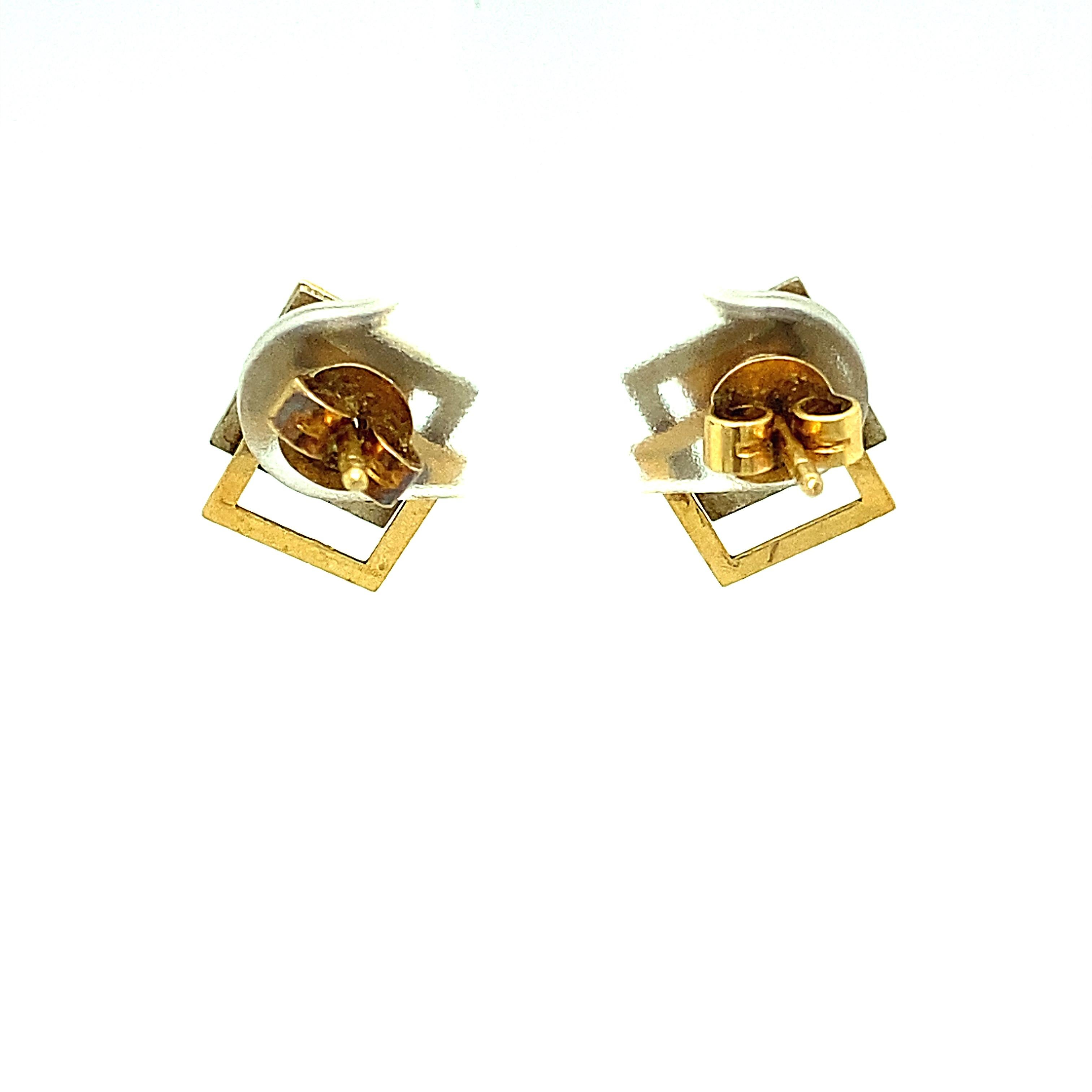 Item Details: 
Metal Type: 14 Karat Yellow and White Gold
Weight: 2 Grams
Measurements: .50 inches height x .25 inches width

Item Features:
Made in the 1940s Retro Era, these earrings are a perfect example of that time period. Showcasing an