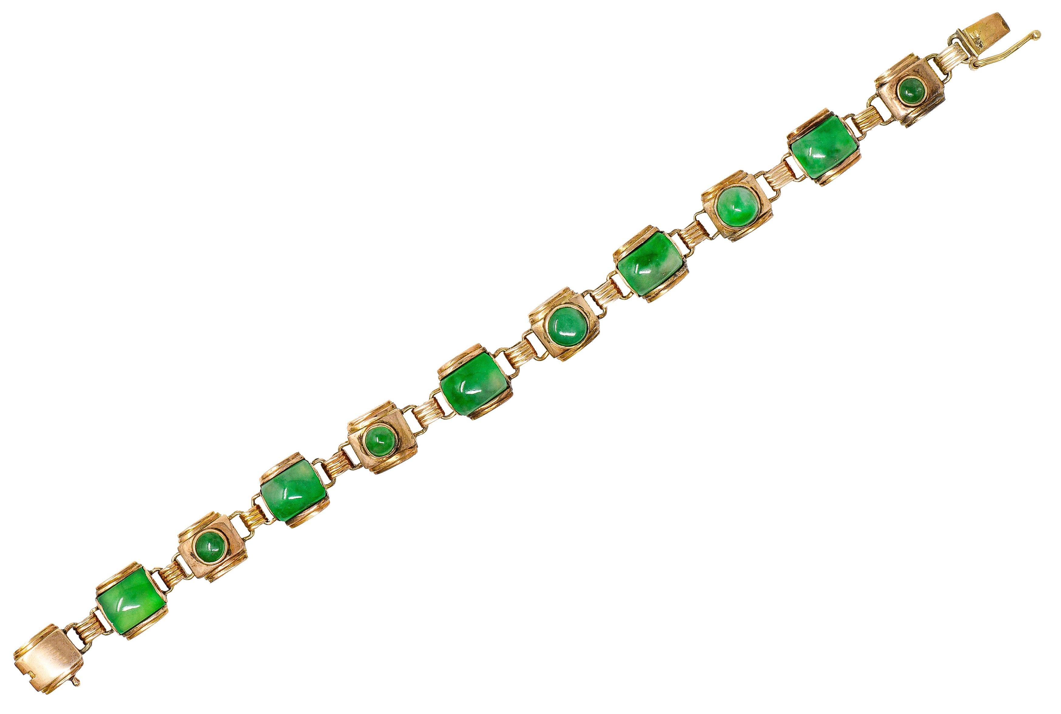 Bracelet is comprised of cushion formed links alternating with spacer links. All are brightly polished with a deeply ridged texture throughout. Featuring round and calibrè cut jadeite jade cabochons - varied in size. Translucent and strongly mottled