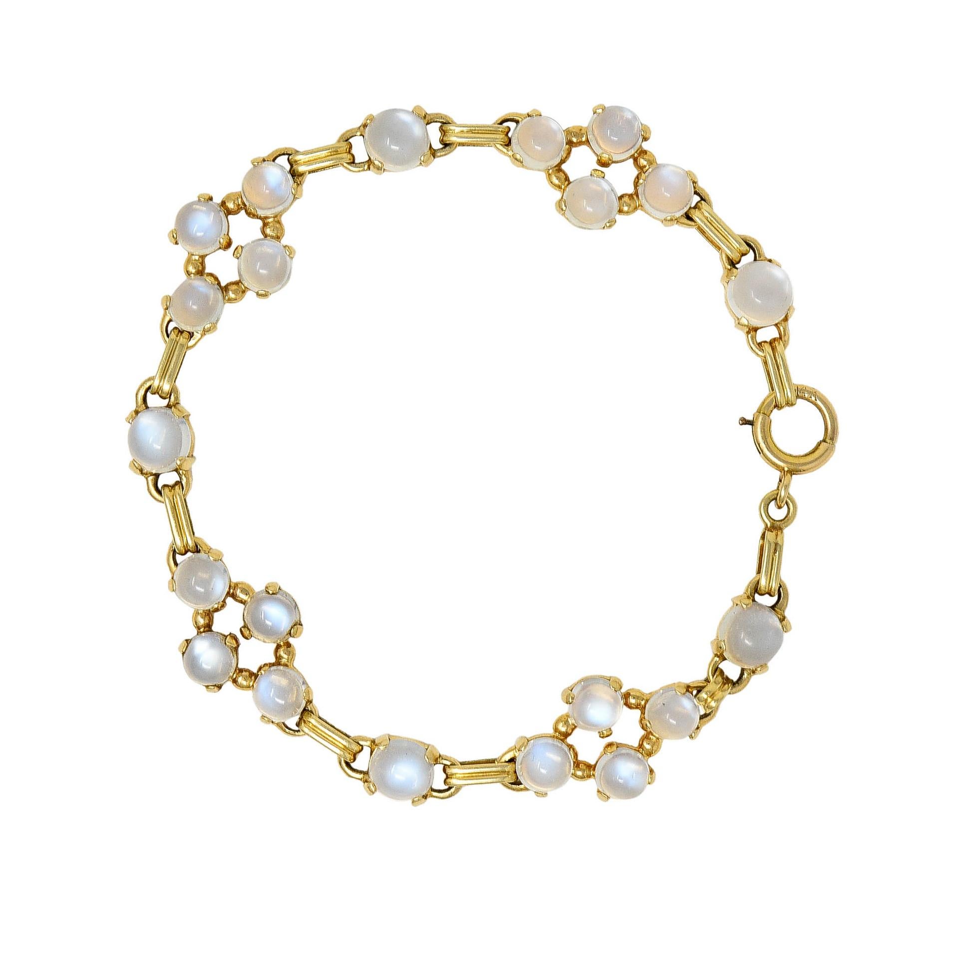 Link style bracelet features alternating moonstone cabochons and gold grooved links

Measuring from 6.0 mm to 5.0 mm in diameter - prong set

Moonstones are well matched and display prominent blue adularescence

Some arranged in engaging quatrefoil