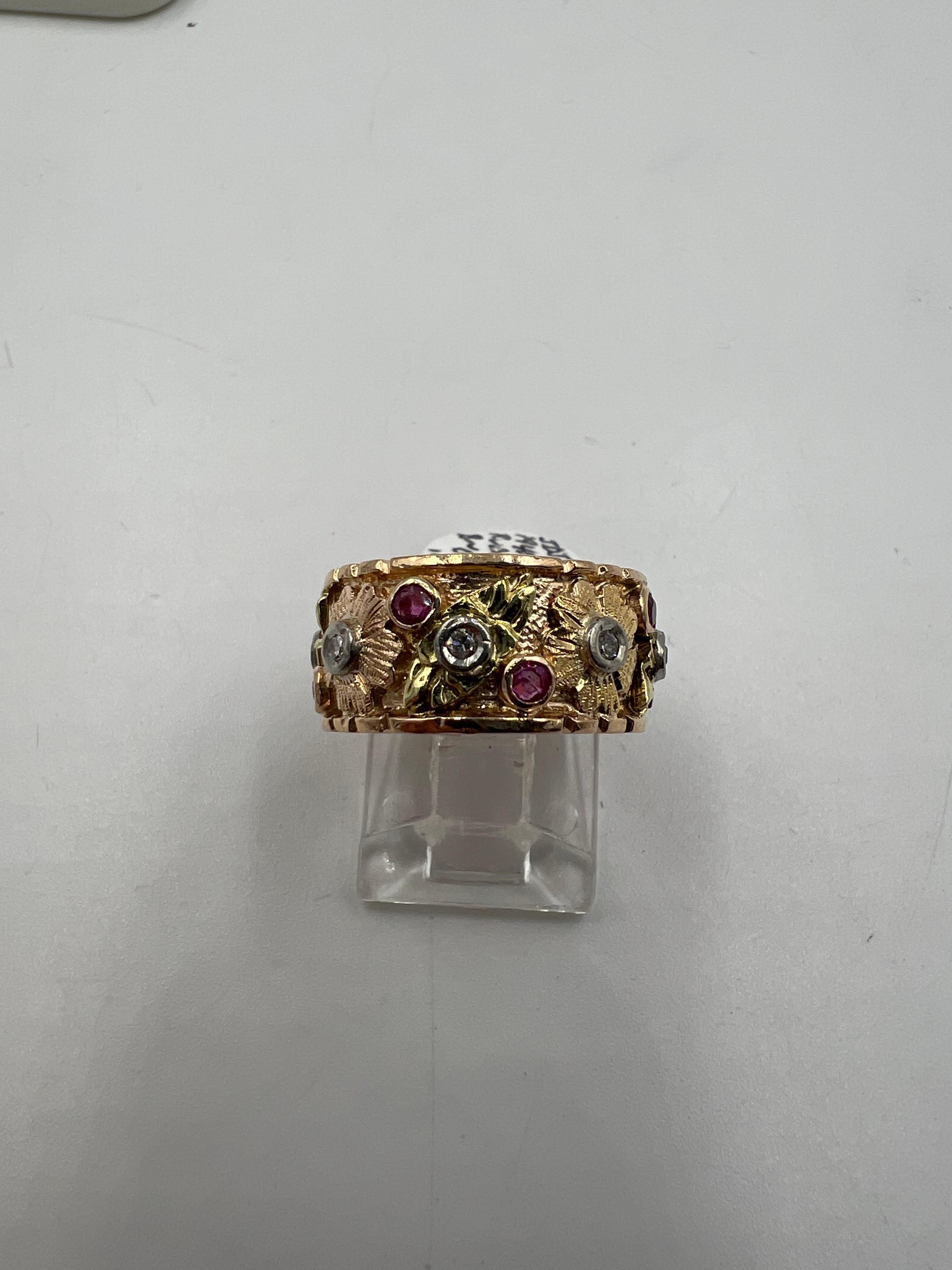 1940s Retro 14k pink gold ruby diamond wide band ring.

  This is one of the more beautiful 1940s retro pink gold ruby diamond wide band rings.  This ring is made up predominantly of pink gold, but it also has green gold and white gold accents. 