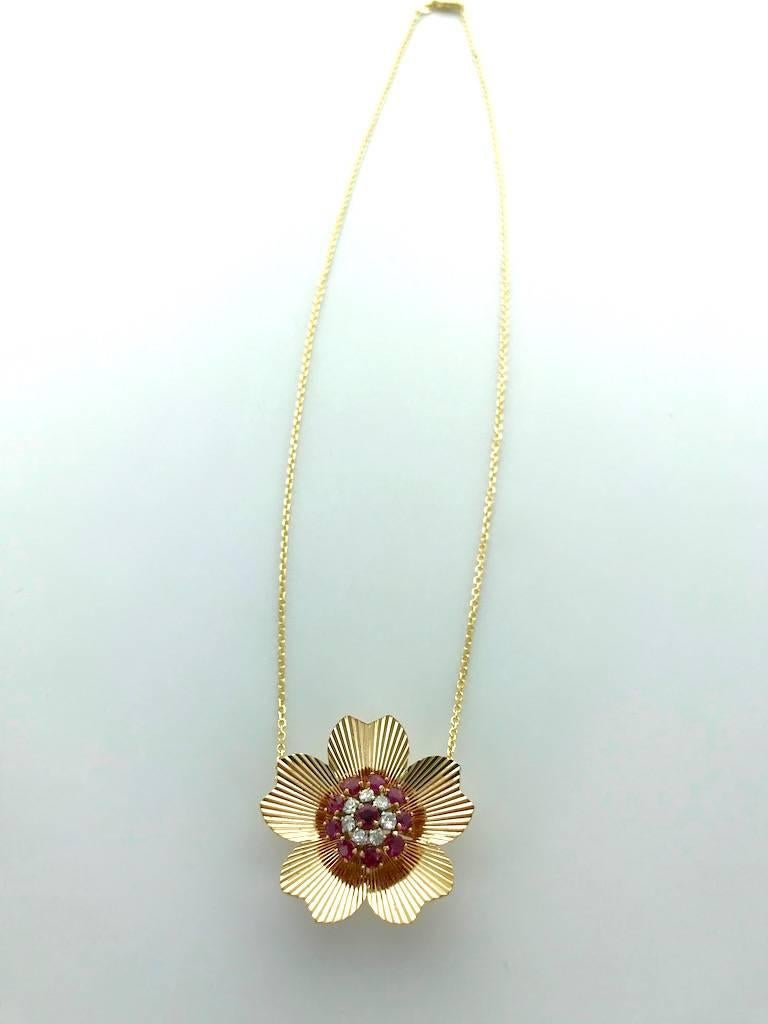 1940S Retro Ruby Diamond Yellow Gold Pendant Necklace.
Flower stylized design beautifully realized.