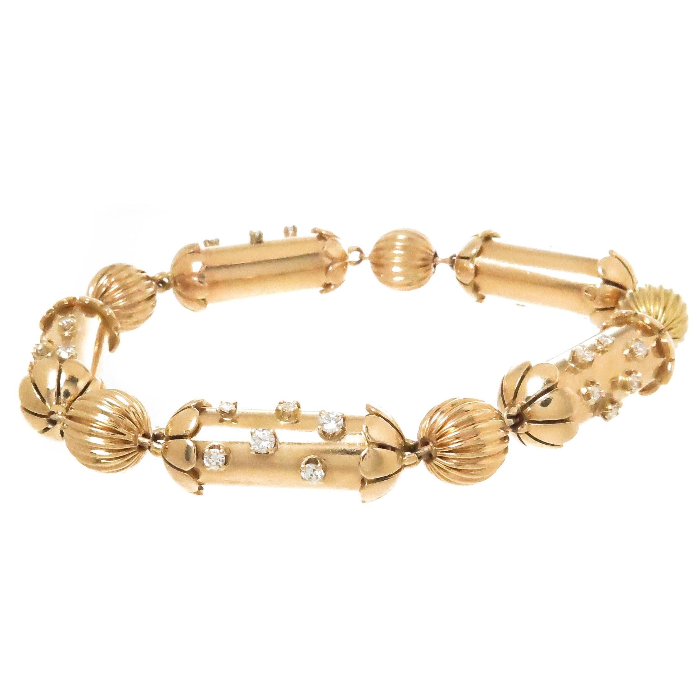 Circa 1940s set of 3 stacking flexible 14K yellow Gold link bracelets very much in the style and design of John Rubel, these 3 Bracelets have alternating Barrel links with end caps and ribbed Ball links, each is set in the Patriotic Red White and
