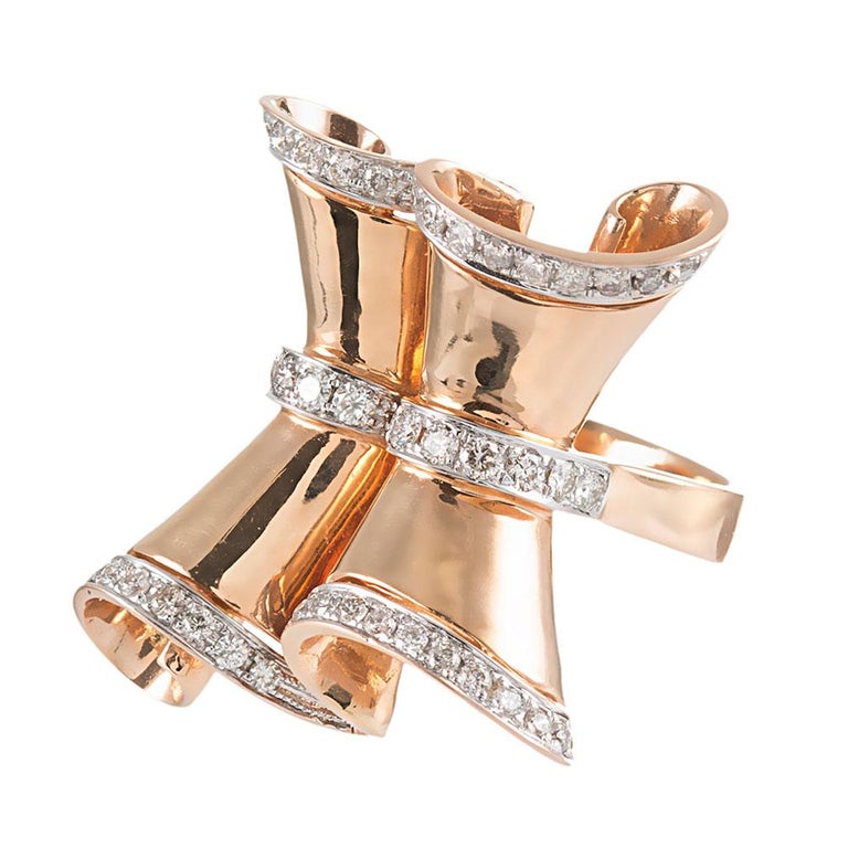 Fanciful retro style is celebrated with this playful, yet sophisticated design. The swirling golden top is adorned with three rows of brilliant white diamonds that weigh approximately 1.15 carats in total. Made of 18k rose gold. 