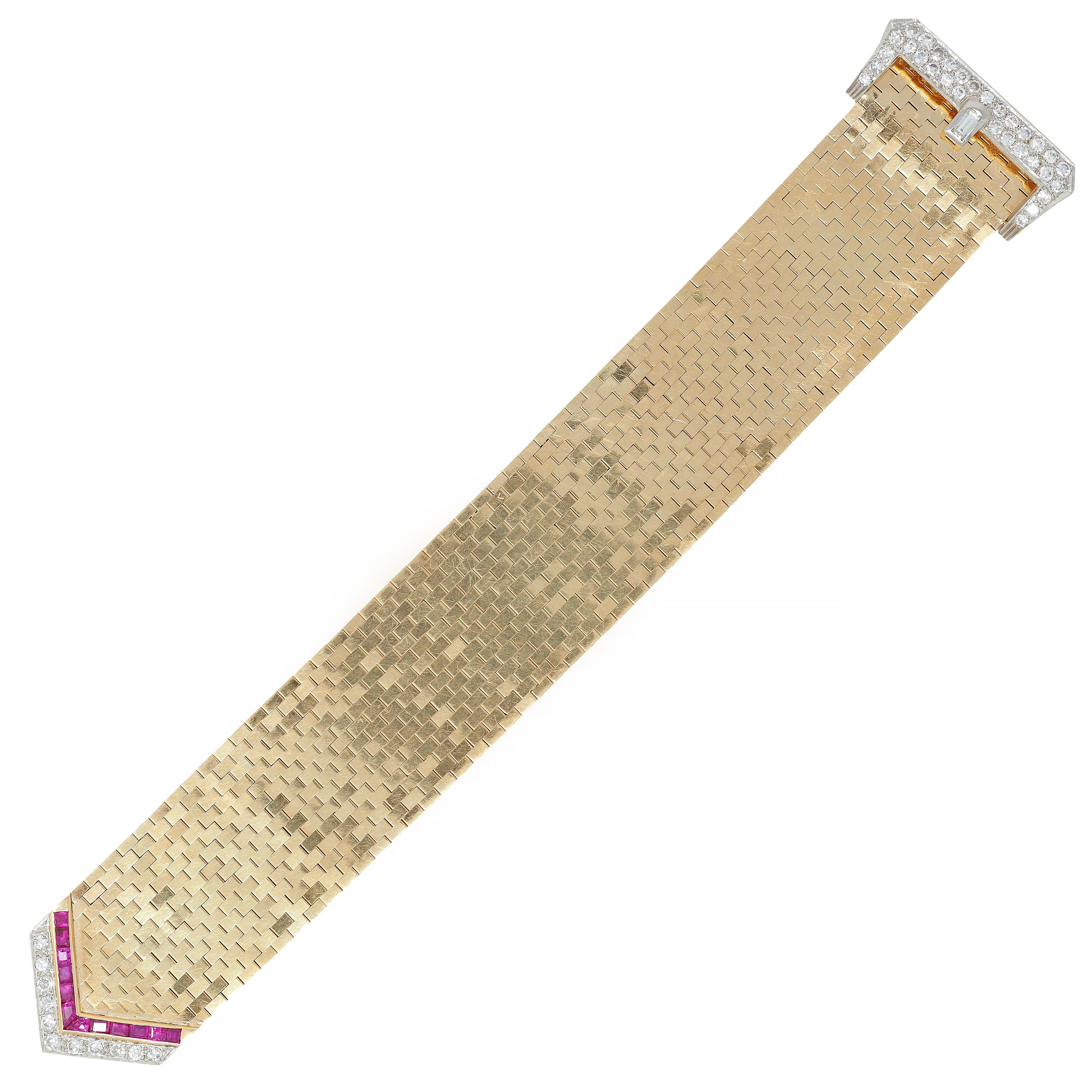 Featuring a highly polished, gold brick link bracelet with buckle
Buckle clasp set with square and fancy cut rubies weighing approximately 2.16 carats, bright pinkish red
Additional round brilliant and emerald cut diamonds set throughout
Weighing