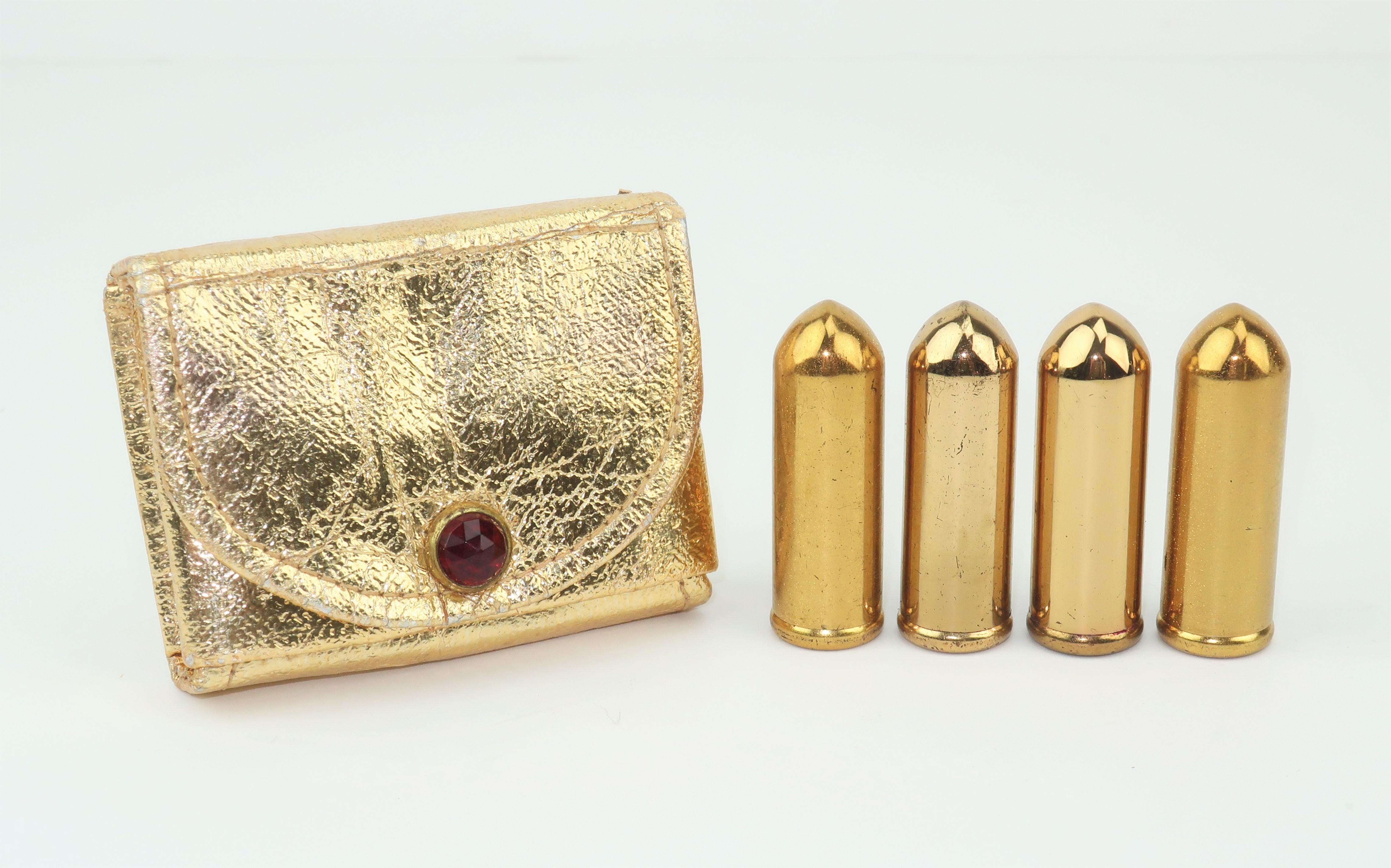 The iconic American cosmetics company, Revlon, has been a leader in the beauty industry since the 1930's with everything from nail enamel to lipsticks.  This 1940's set includes four metal bullet shaped lipsticks with a a gold carrying case