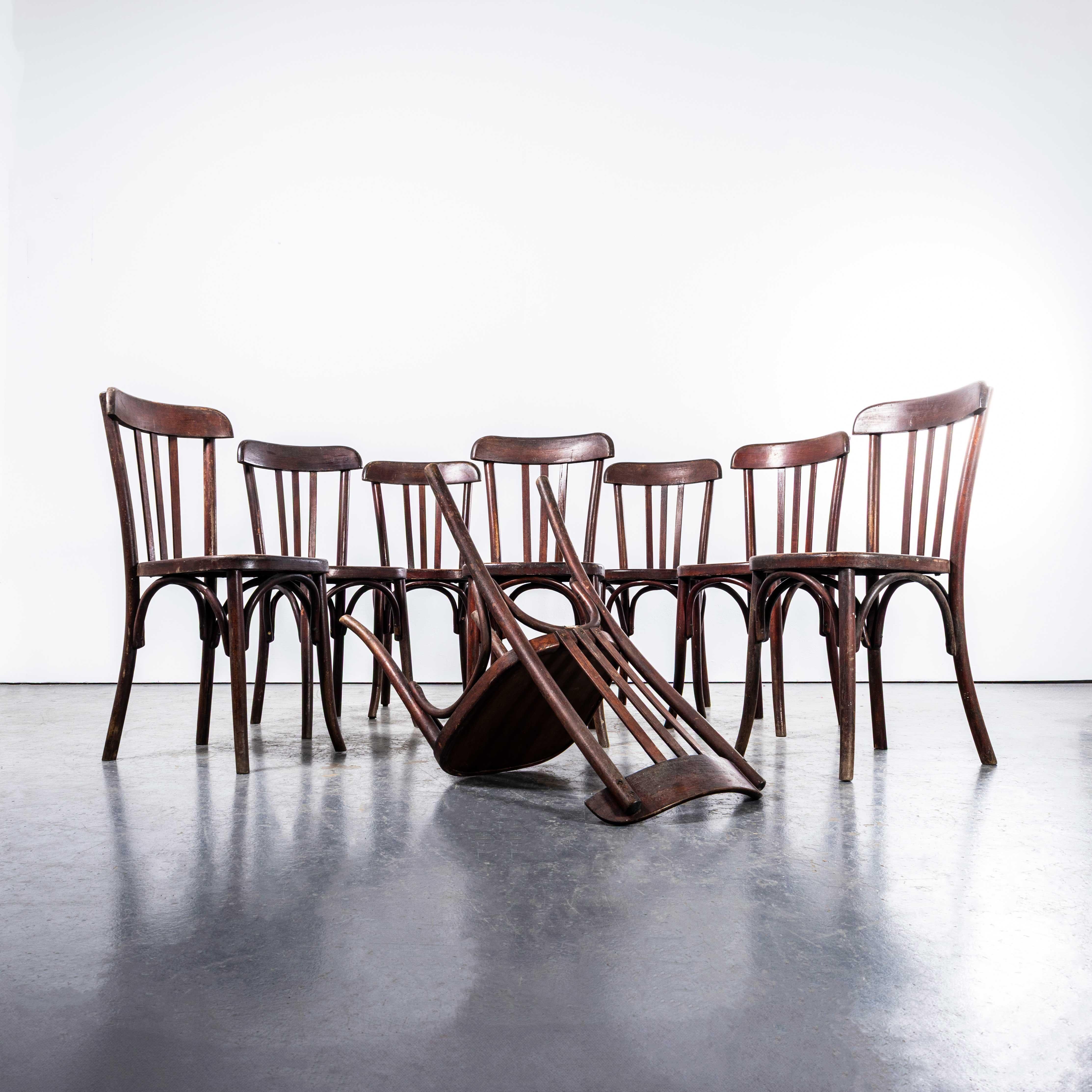 1940’s Rich Dark Fischel Bentwood Dining Chairs – Set Of Eight. 
The process of steam bending beech to create elegant chairs was discovered and developed by Thonet, but when its patents expired in 1869 many companies including Fischel launched