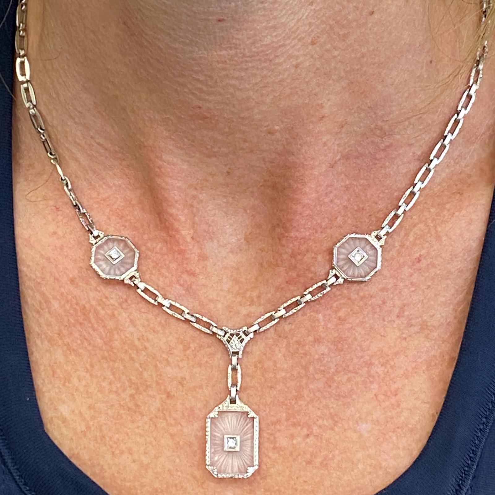 Rock Crystal Diamond Vintage drop necklace is fashioned in 14 karat white gold. The necklace features carved rock crystal stations centered with Old European Cut Diamonds. The necklace measures 16 inches in length with a 1.25 inch drop. 