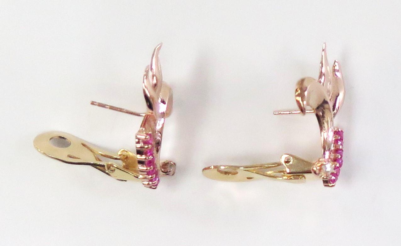 Unusual Vintage 14 karat rose gold omega back pierced earrings from the 1940s contain synthetic Ruby (which were typically used during that era) and two Old Mine Cut Diamonds weighing 0.10 Carat total weight. 

Stamped 