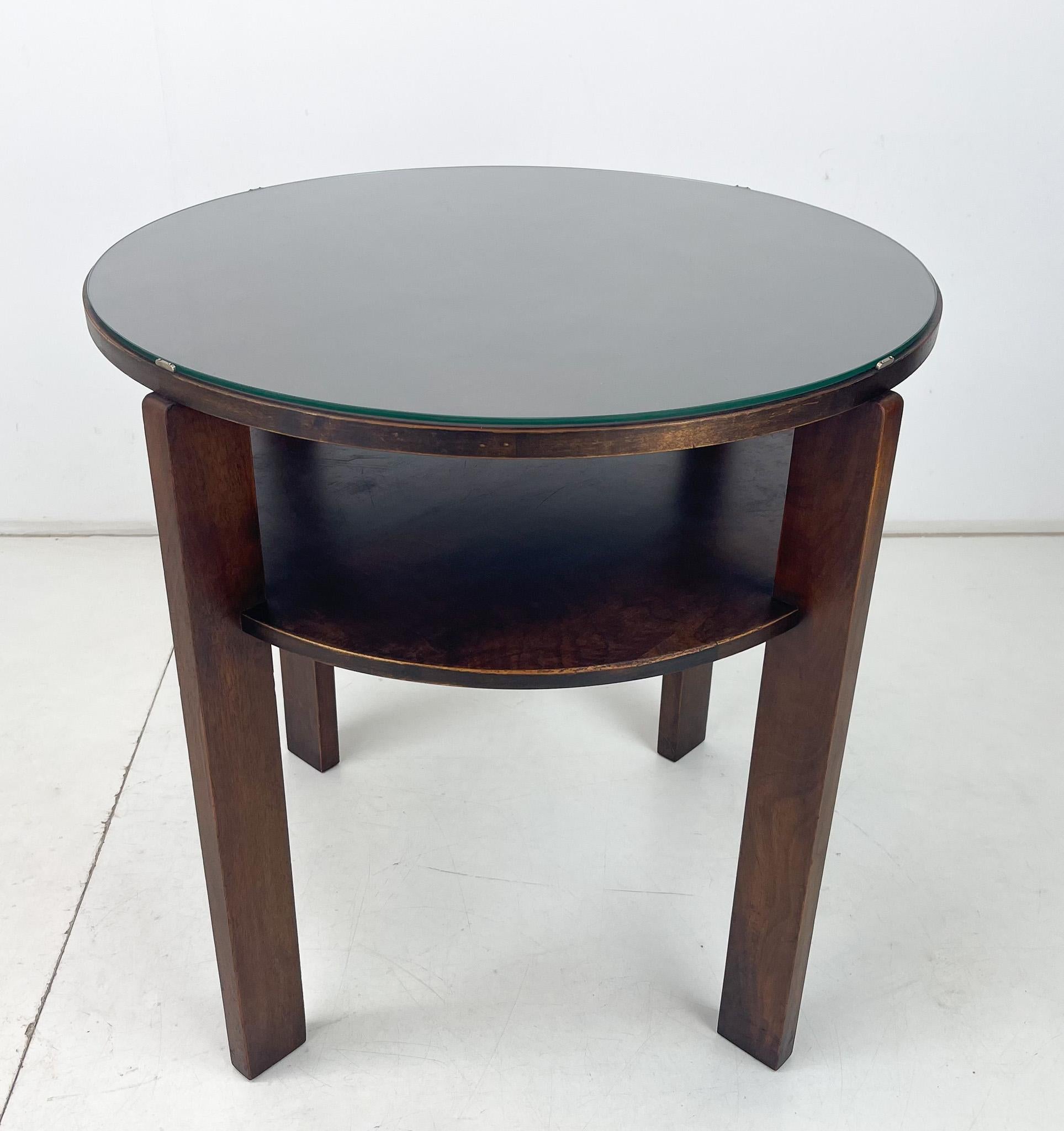 Vintage round wooden coffee table with glass top. Produced in Czechoslovakia in the 1940's. Signs of use are visible in the photos.